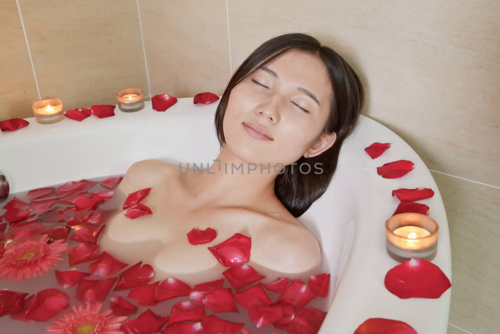 Young Woman Bathing at Health Spa