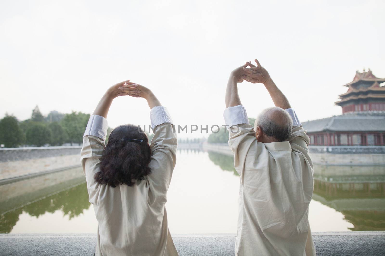 Two Chinese People Exercising