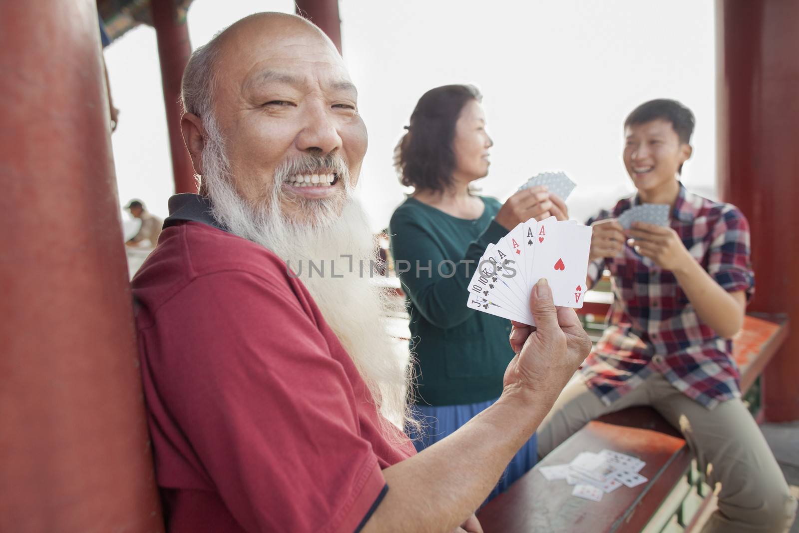 Chinese Family Playing Card In Jing Shan Park by XiXinXing