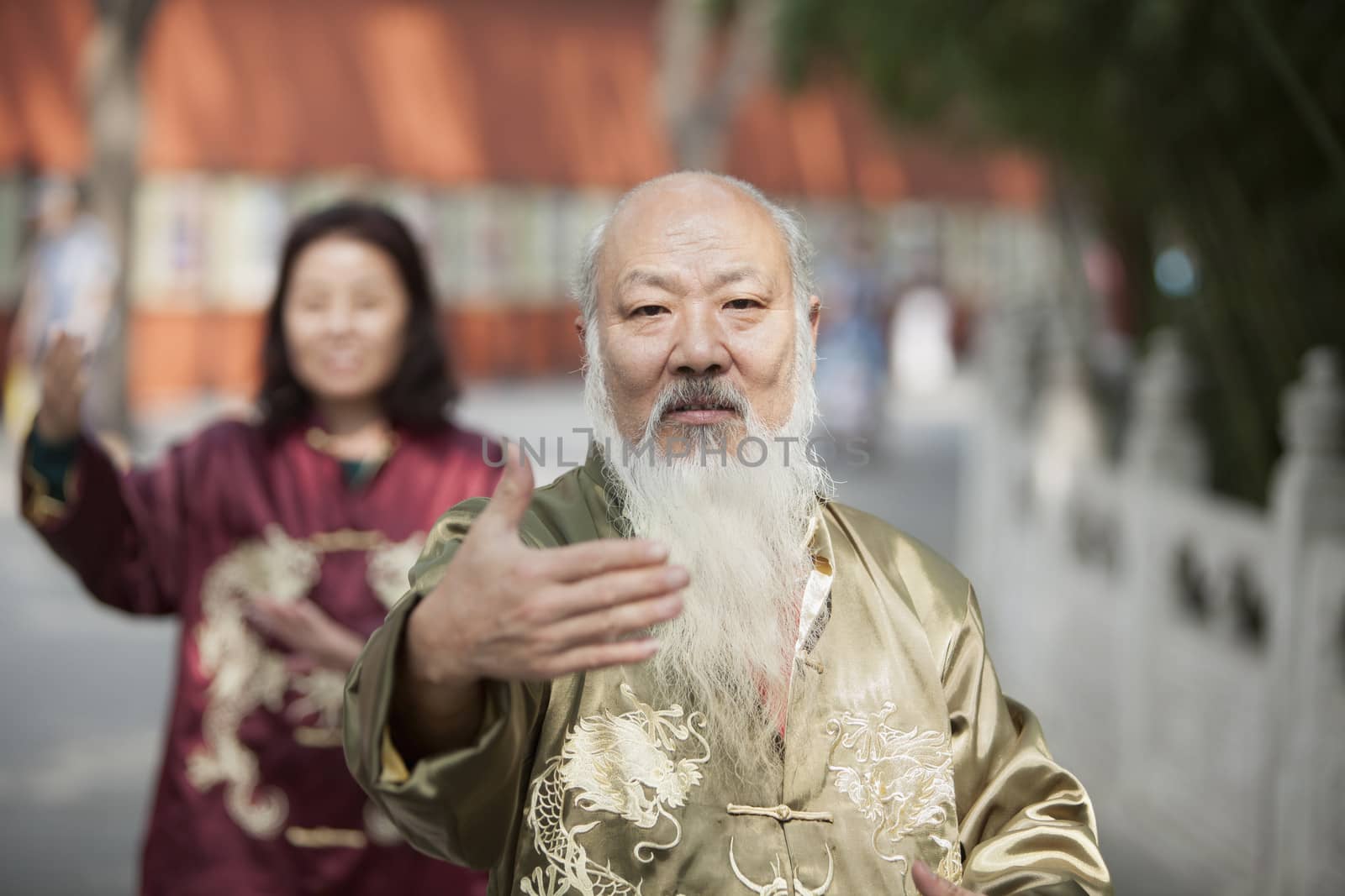 Two Chinese People Practicing Tai Ji
