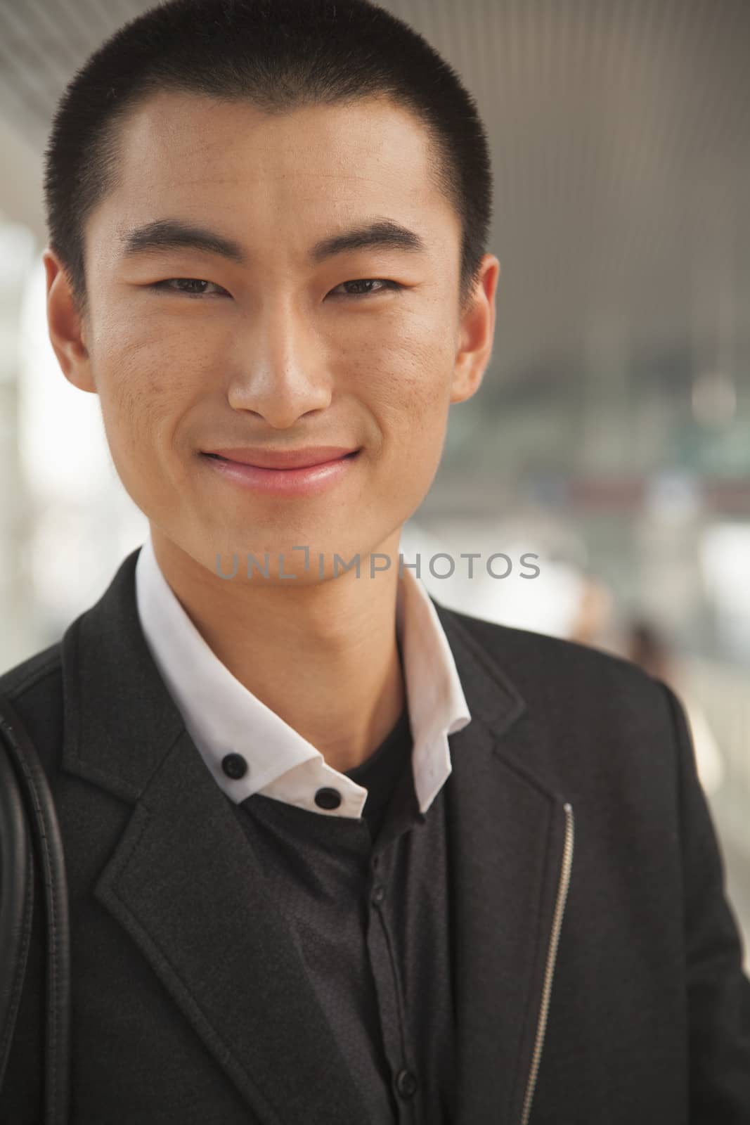 Portrait of Young Man on Train Platform