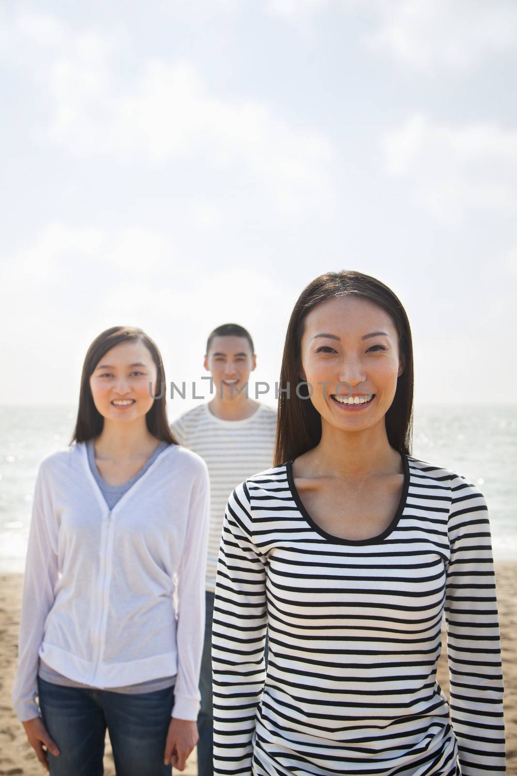 Portrait of Young Woman and Friends at the Beach by XiXinXing
