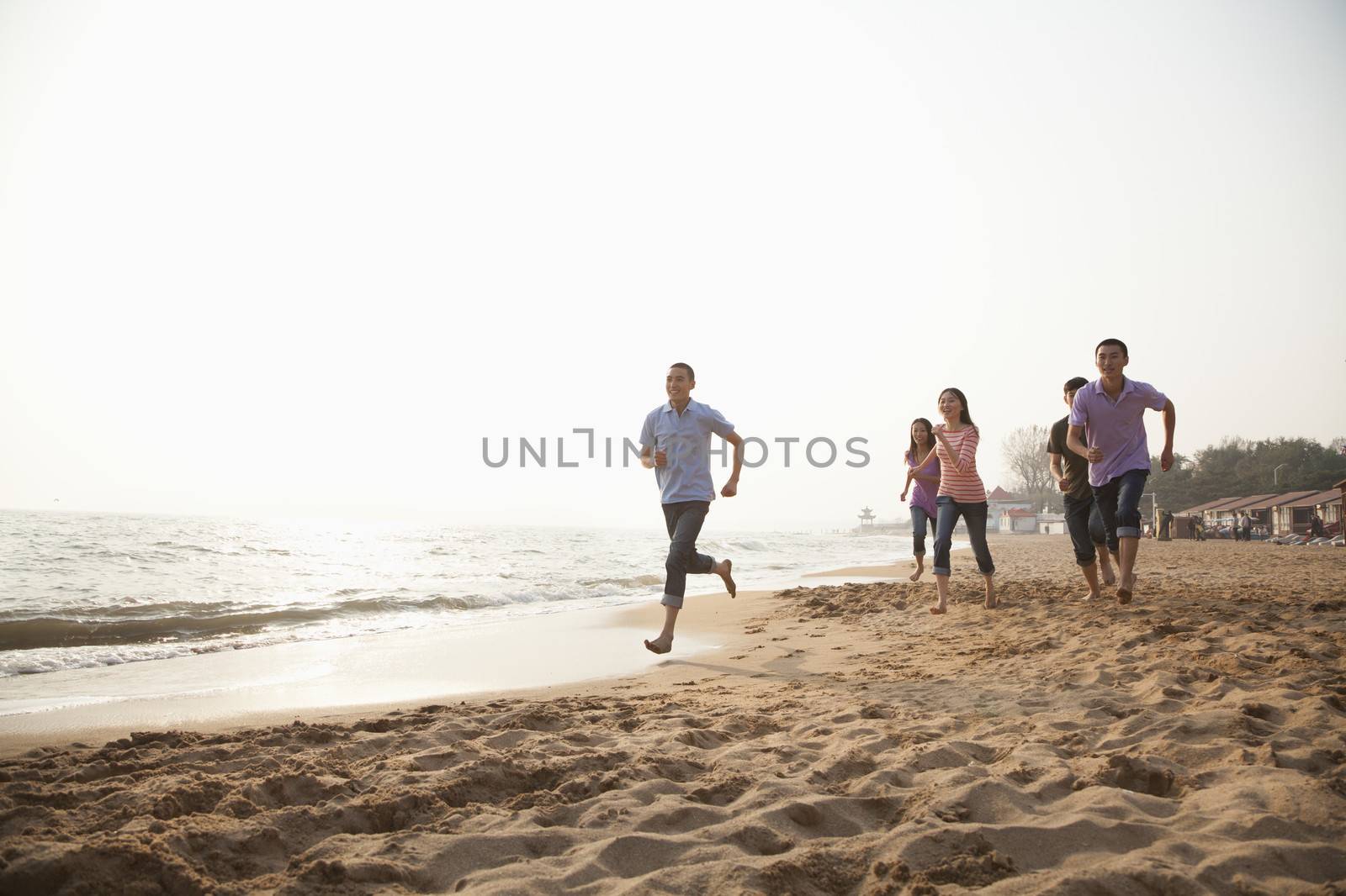 Friends Running at the Beach