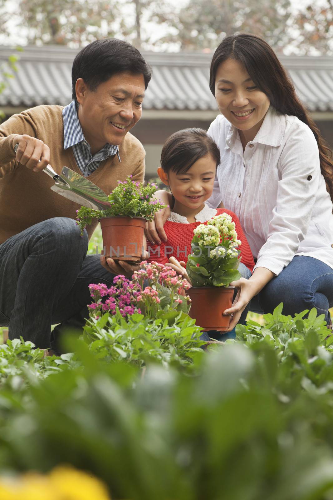 Happy family in garden by XiXinXing