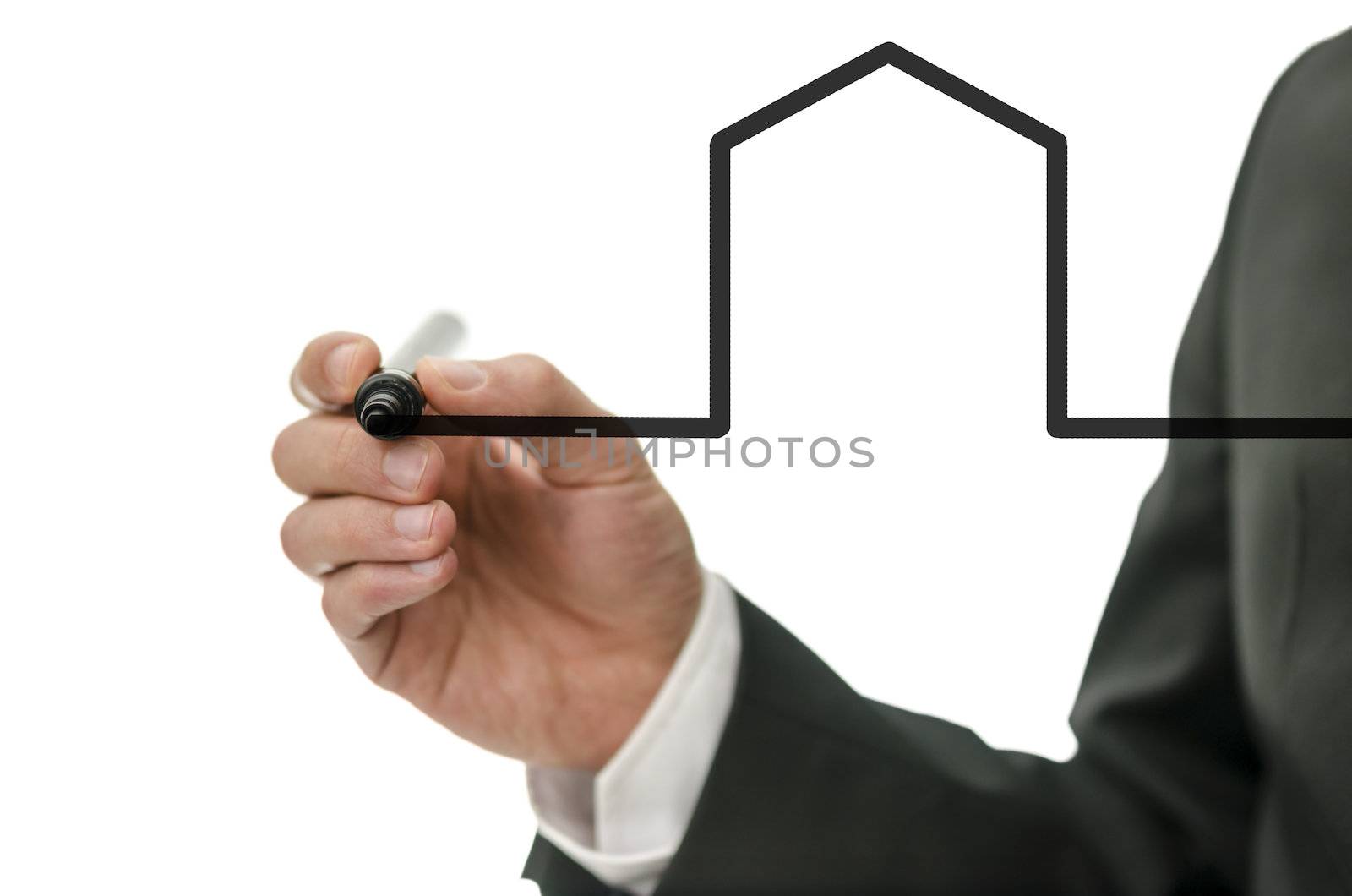 Businessman drawing shape of a house on a virtual whiteboard.