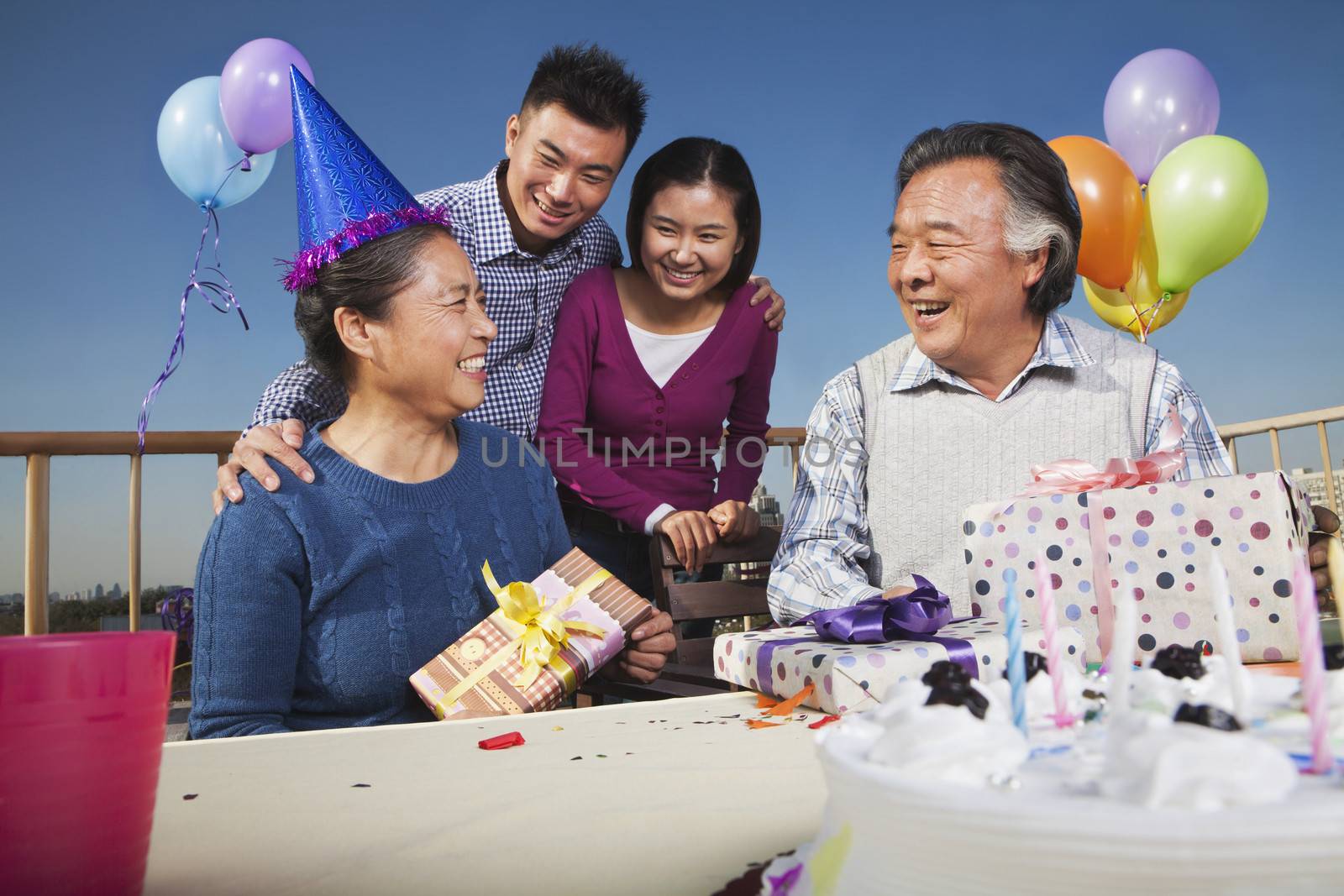 Family celebrating mum's birthday