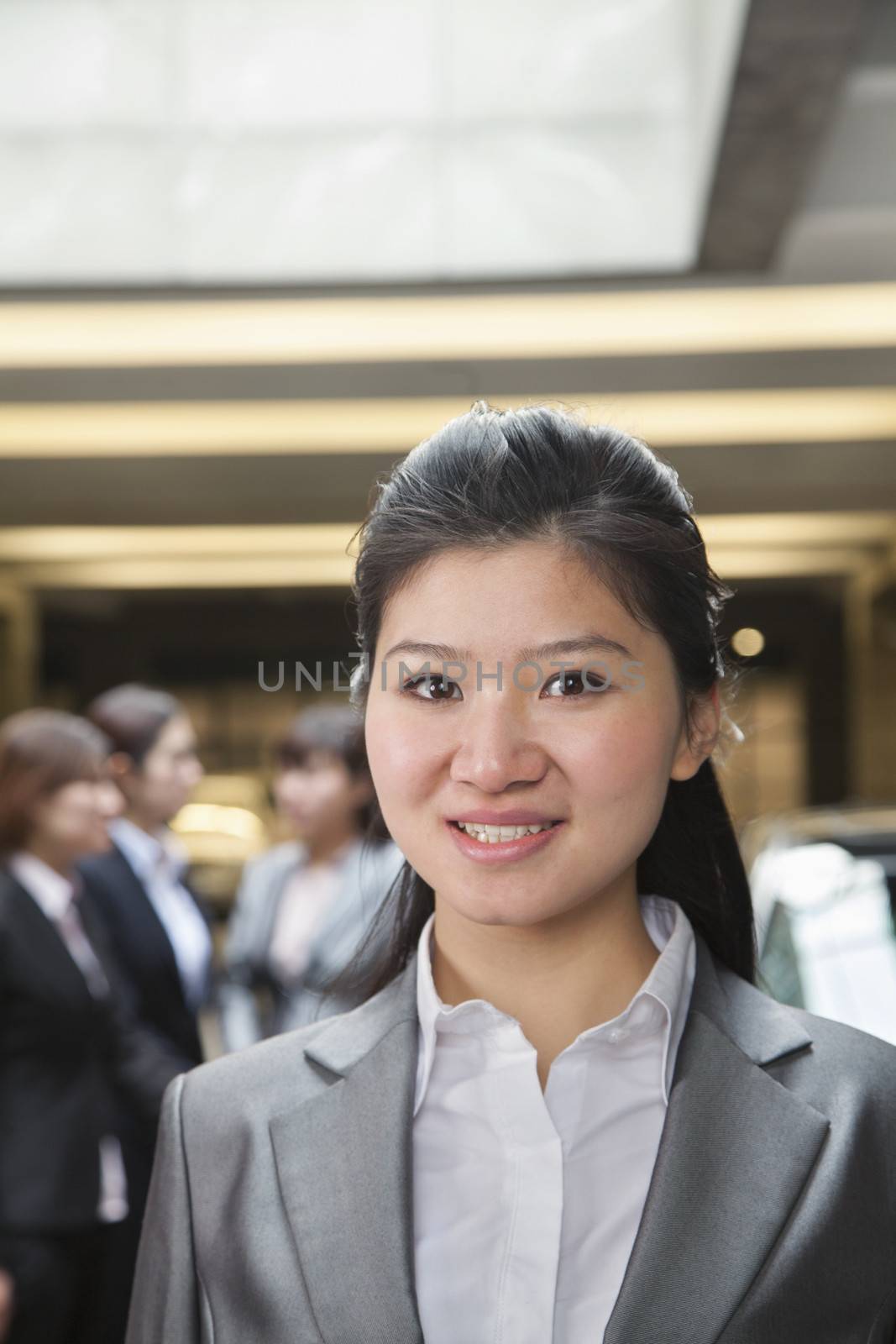 Portrait of Young businesswoman in parking garage 