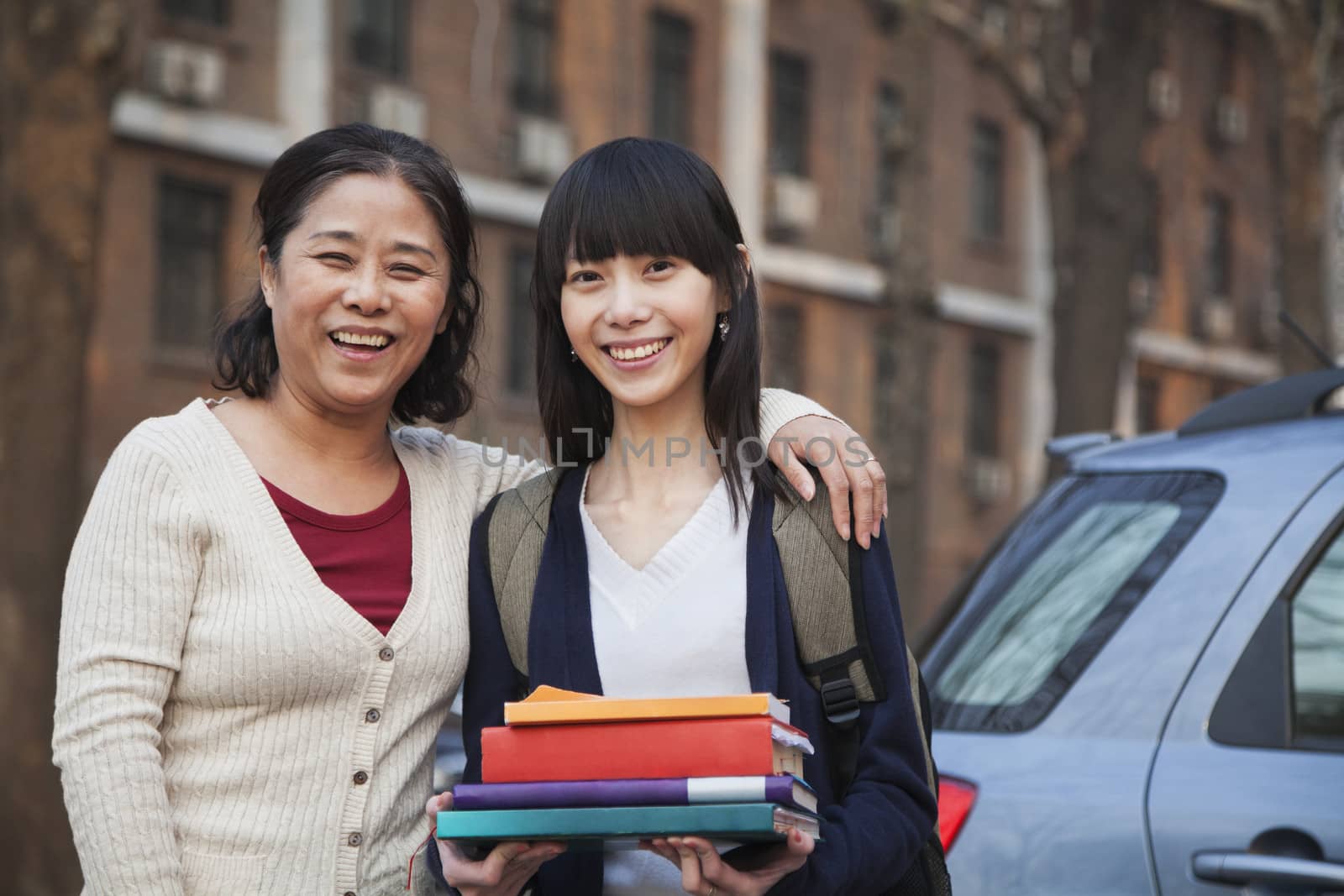 Mother and daughter portrait in front of dormitory