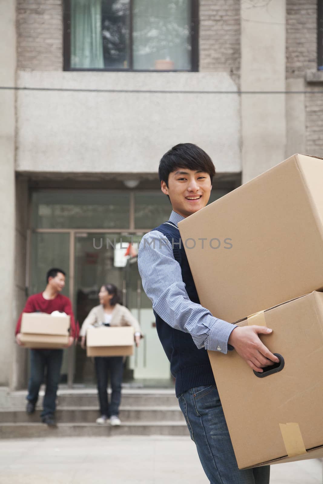 Family moving boxes out of a dormitory at college by XiXinXing