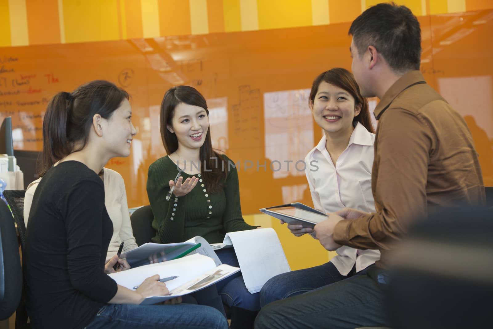 Business People Having Meeting in the Office by XiXinXing