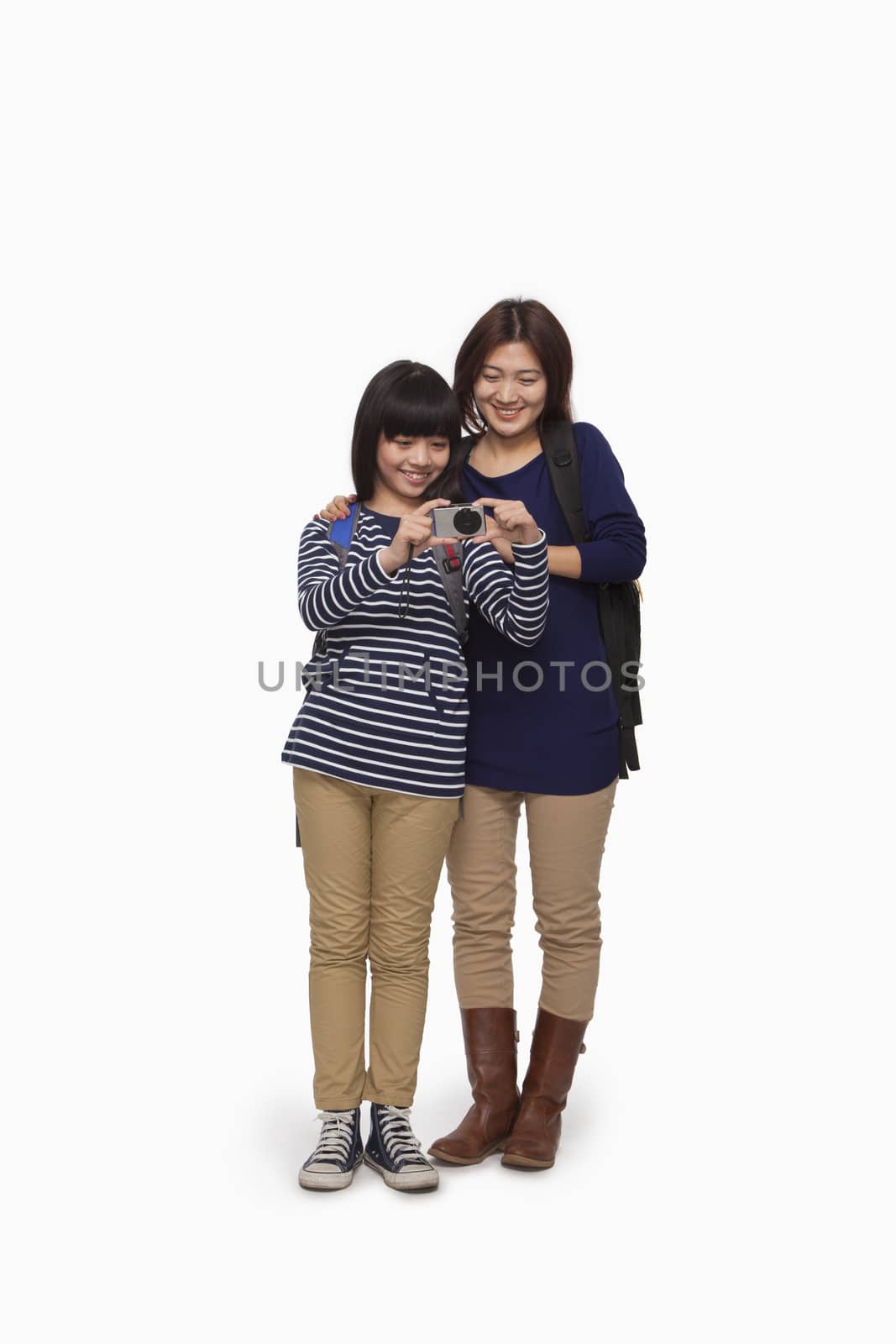 Mother and daughter trying digital camera by XiXinXing