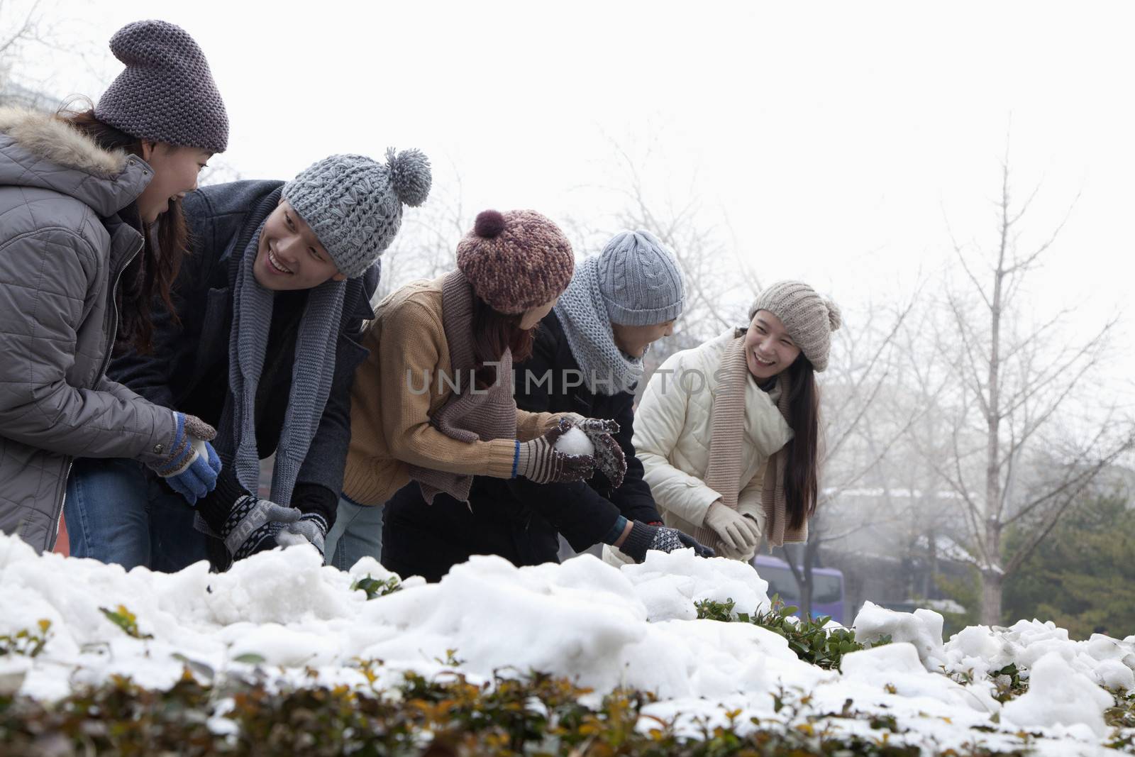Group of Friends Playing in the Snow by XiXinXing