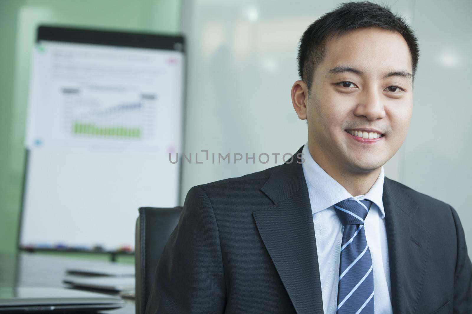 Businessman in meeting room portrait by XiXinXing