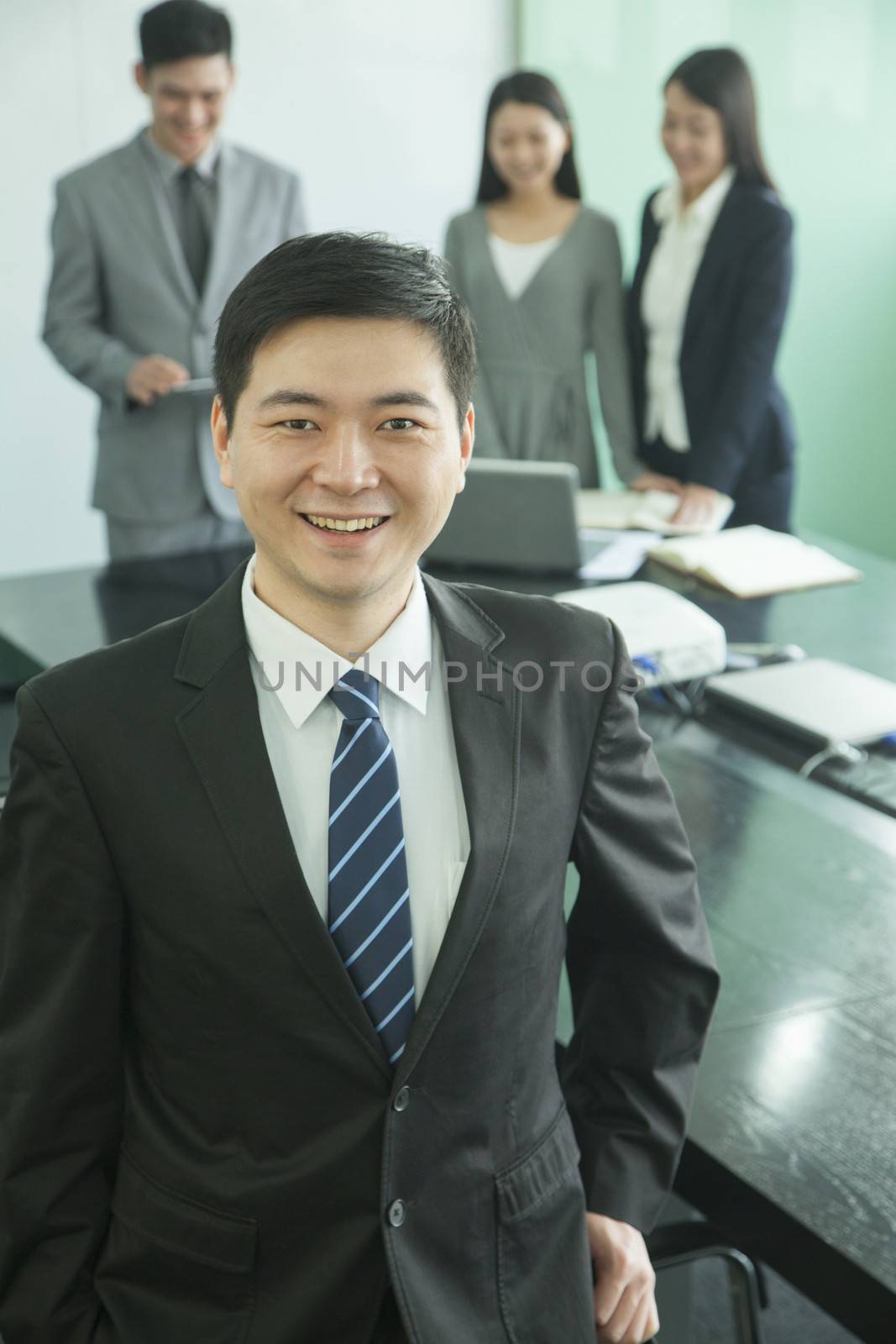 Businessman in Board Room by XiXinXing