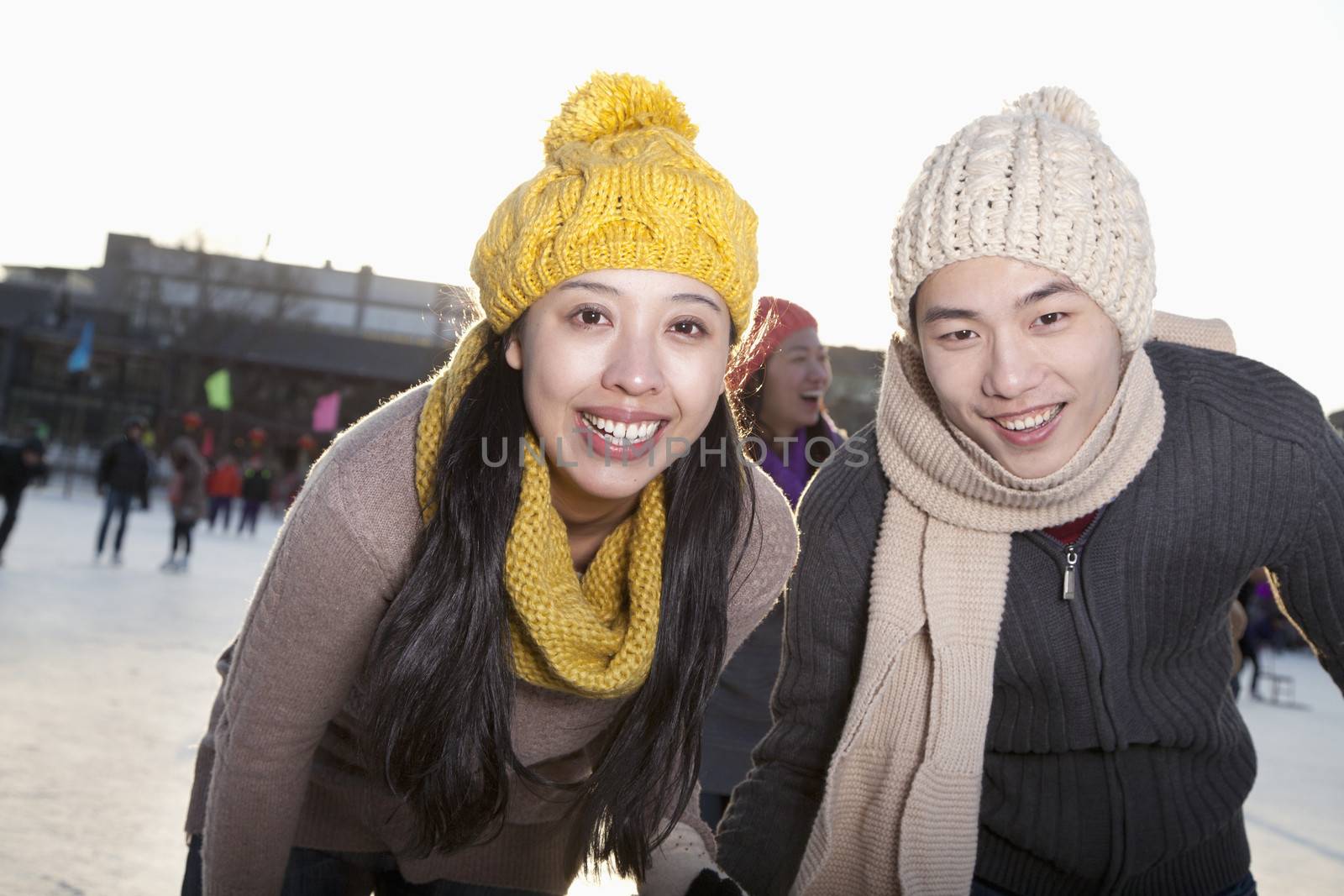 Young couple at ice rink
