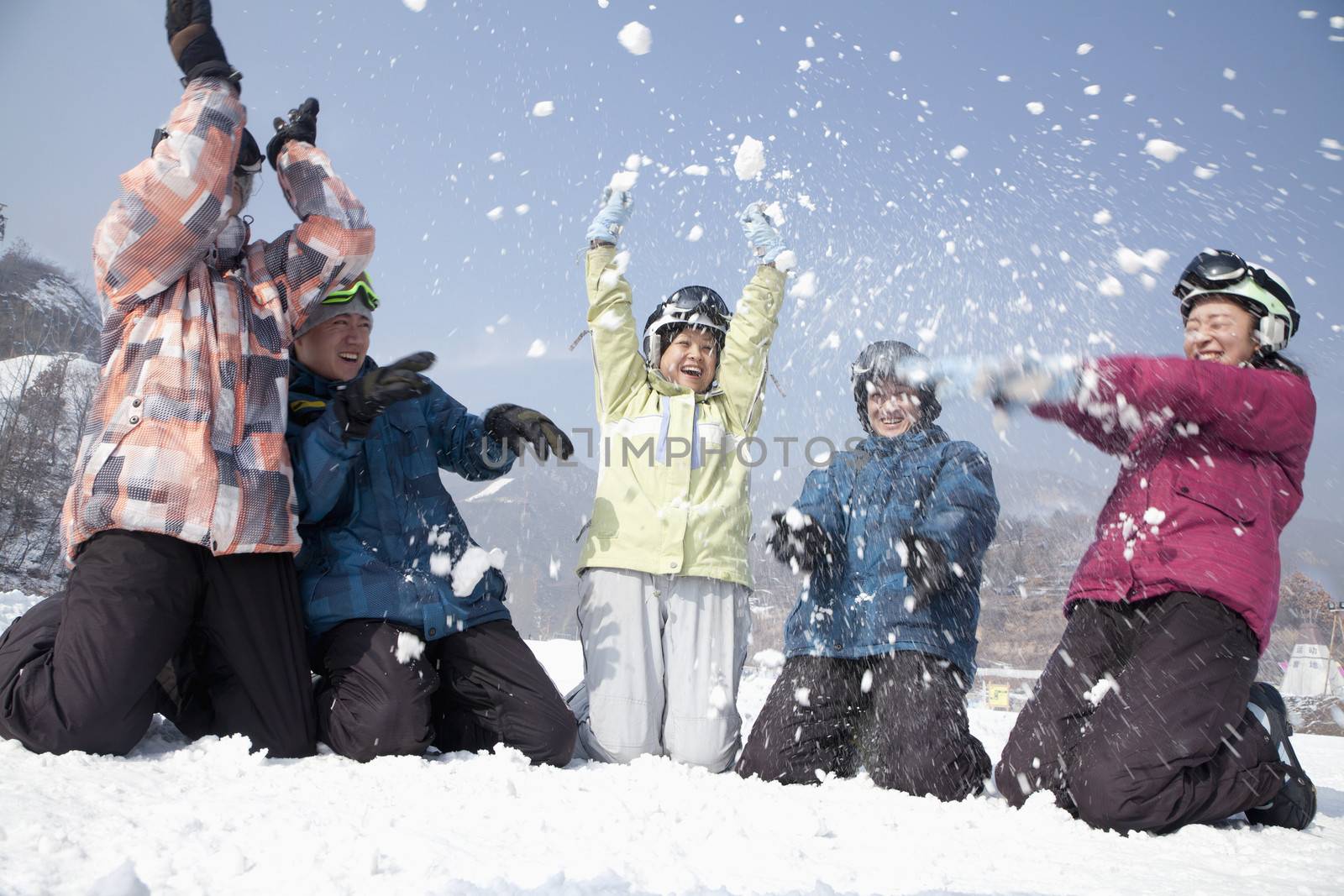 Group of People Playing in the Snow in Ski Resort