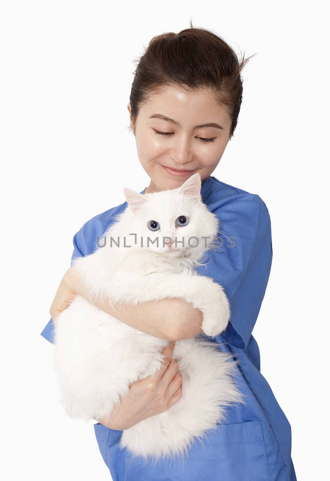 Portrait of female veterinarian holding a white cat by XiXinXing