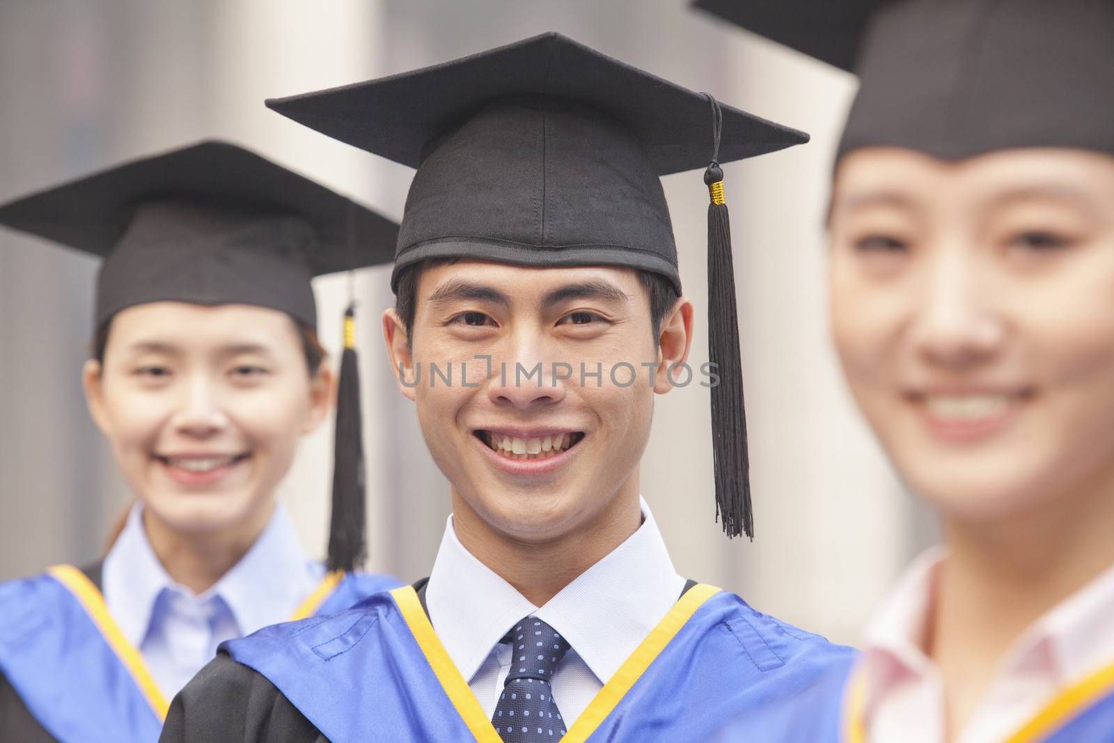  Three University Graduates Smiling in a Row