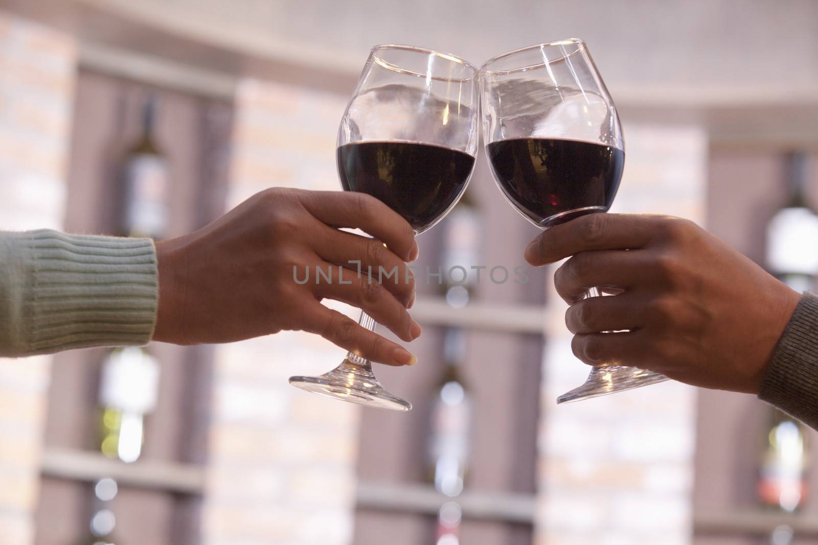 Close Up of Couple Toasting, Hands and Wineglass only