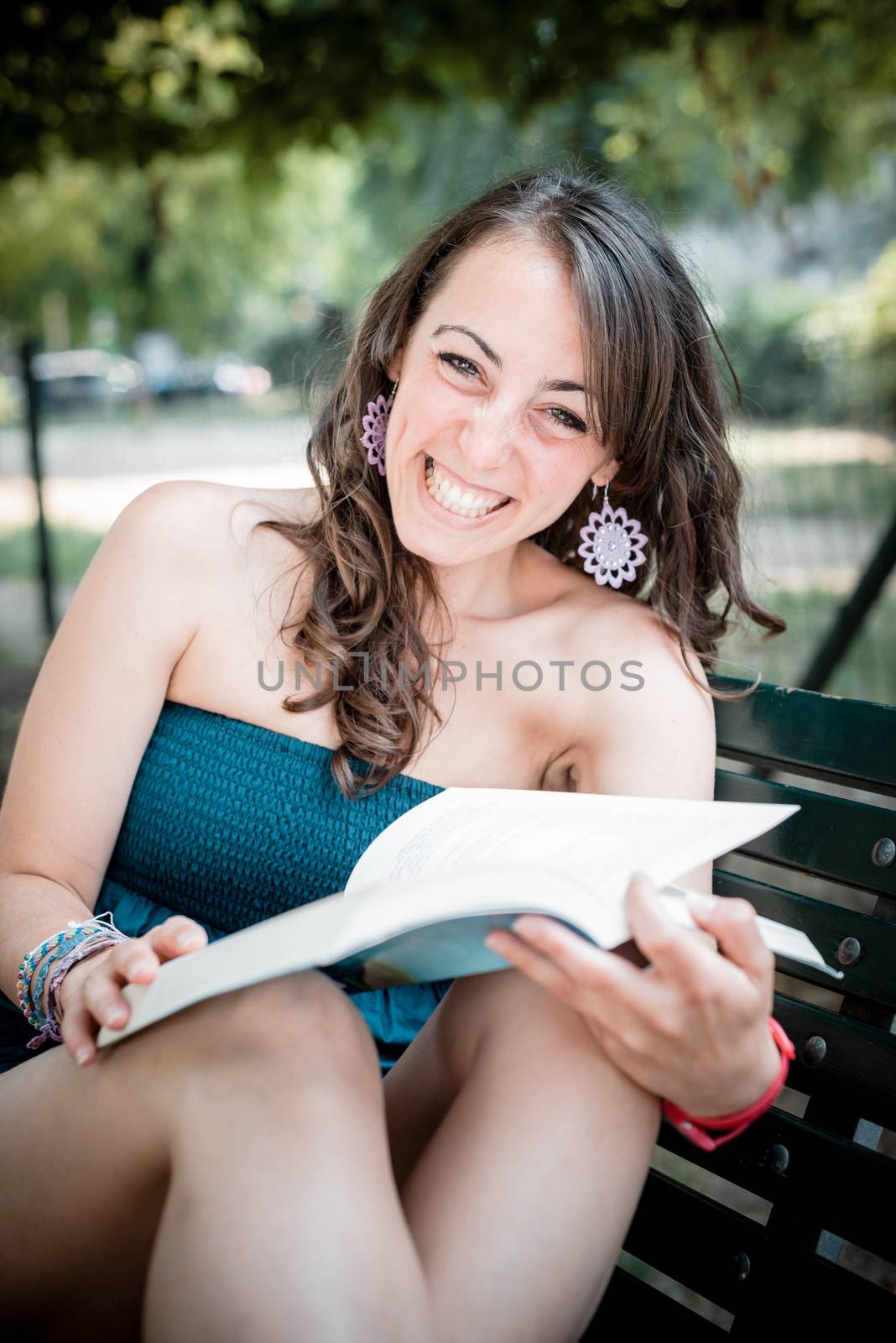 beautiful woman reading book by peus