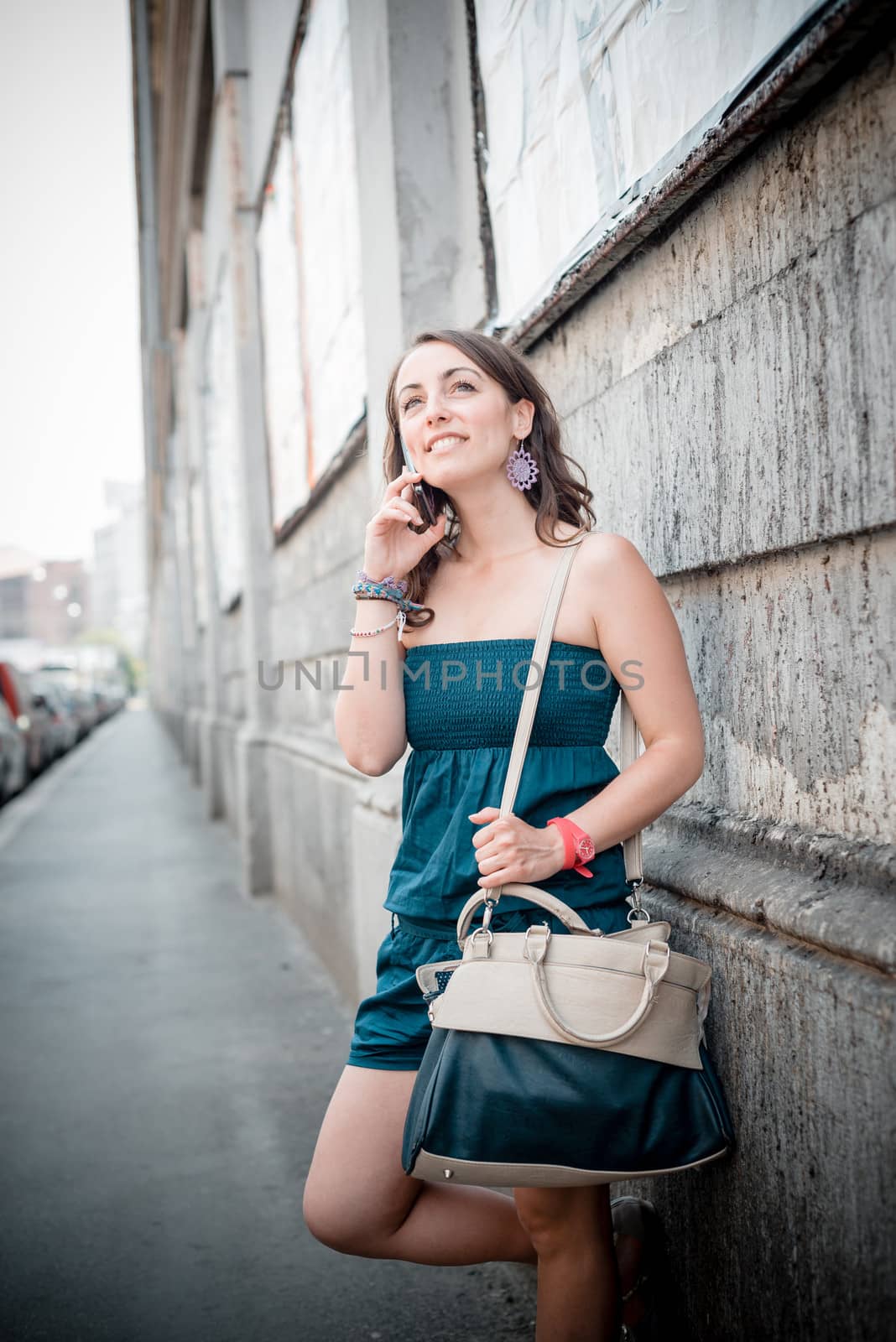 beautiful woman on the phone in the city