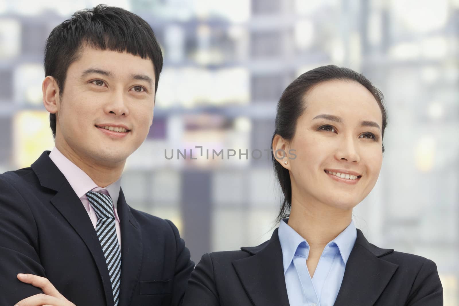 Young business man and woman, portrait 