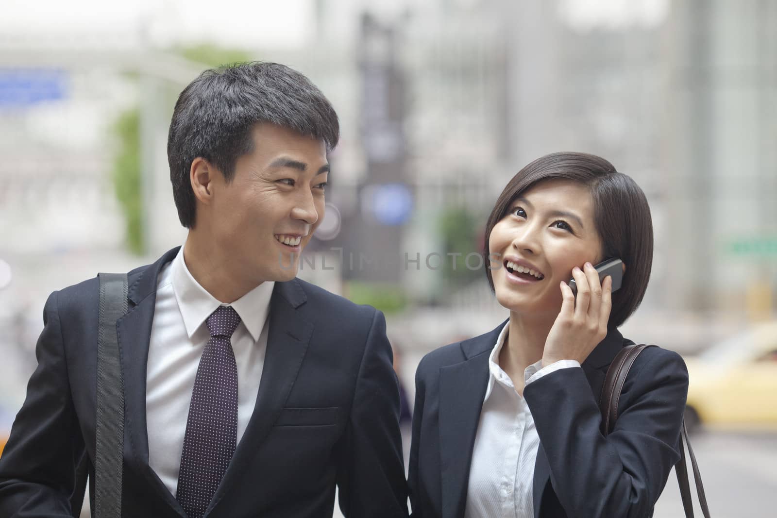 Two Business People Walking Together