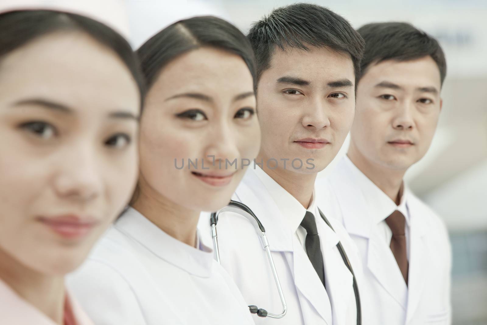 Healthcare workers standing in a row, China by XiXinXing