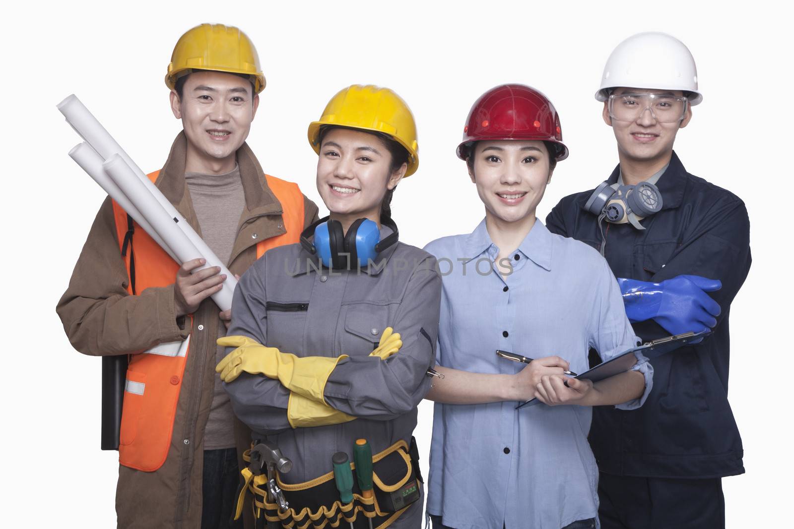 Group of construction workers standing against white background, smiling, portrait by XiXinXing