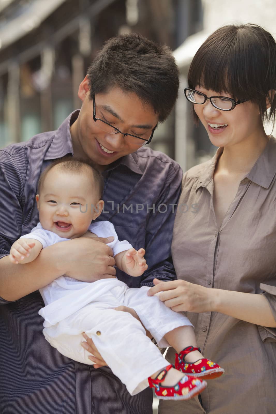 Portrait of family with baby, holding baby by XiXinXing