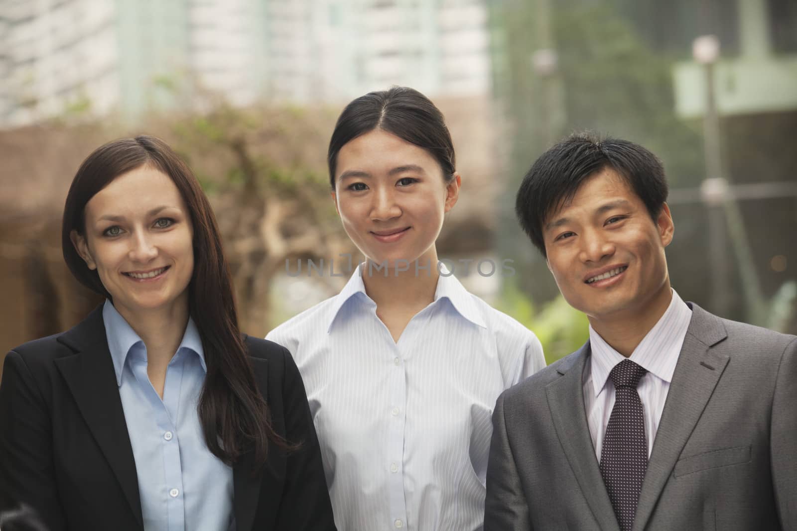 Portrait of three business people, multi-ethnic group by XiXinXing