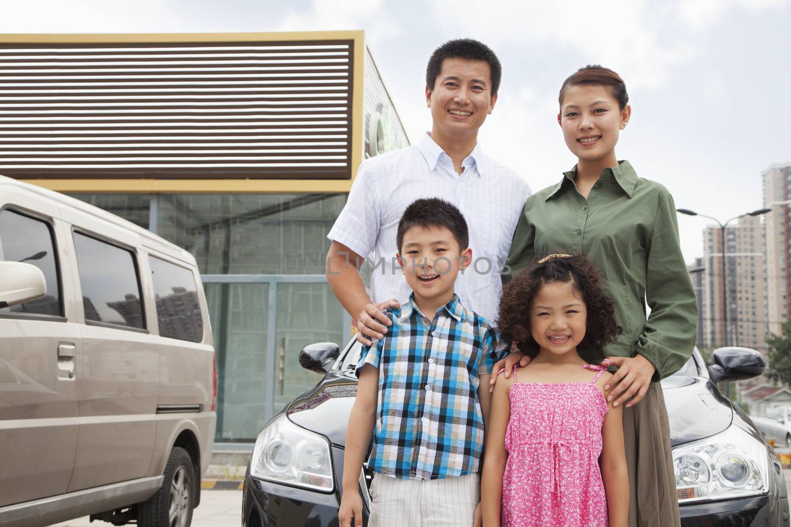 Family smiling in front of the car, portrait by XiXinXing