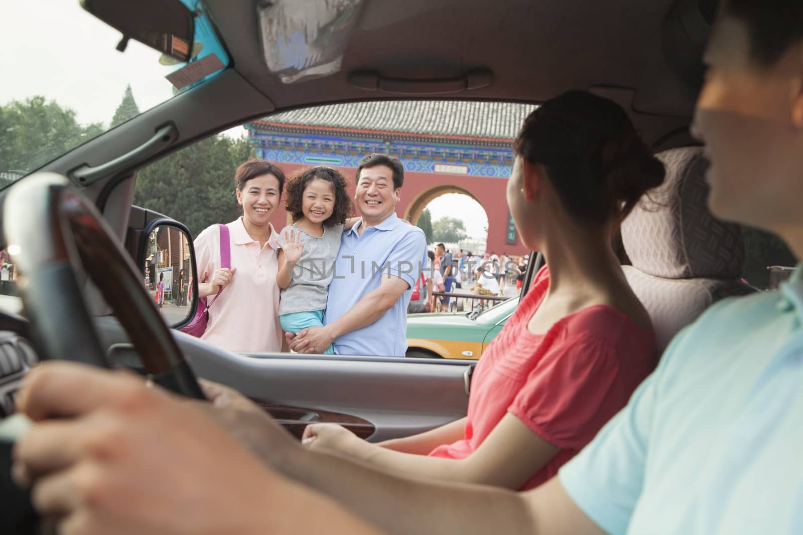 Parents driving and saying good bay to son and grandparents by XiXinXing