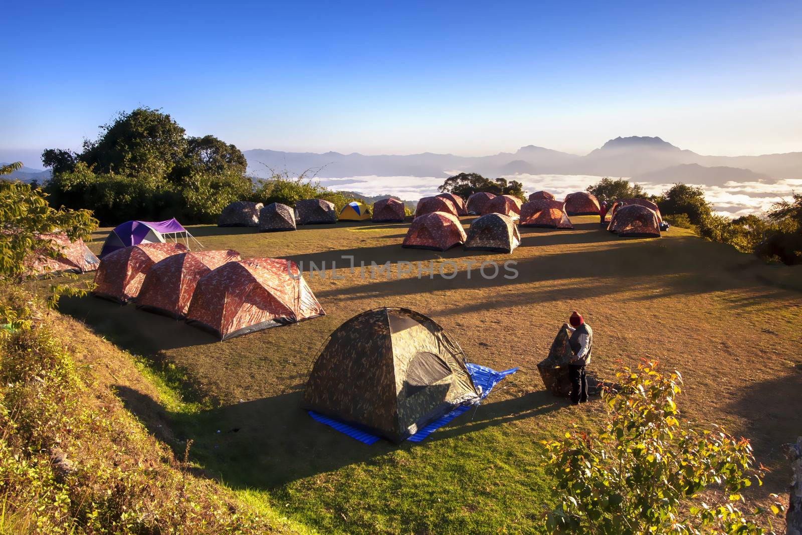 Tent camping in nature with wide angle landscape
