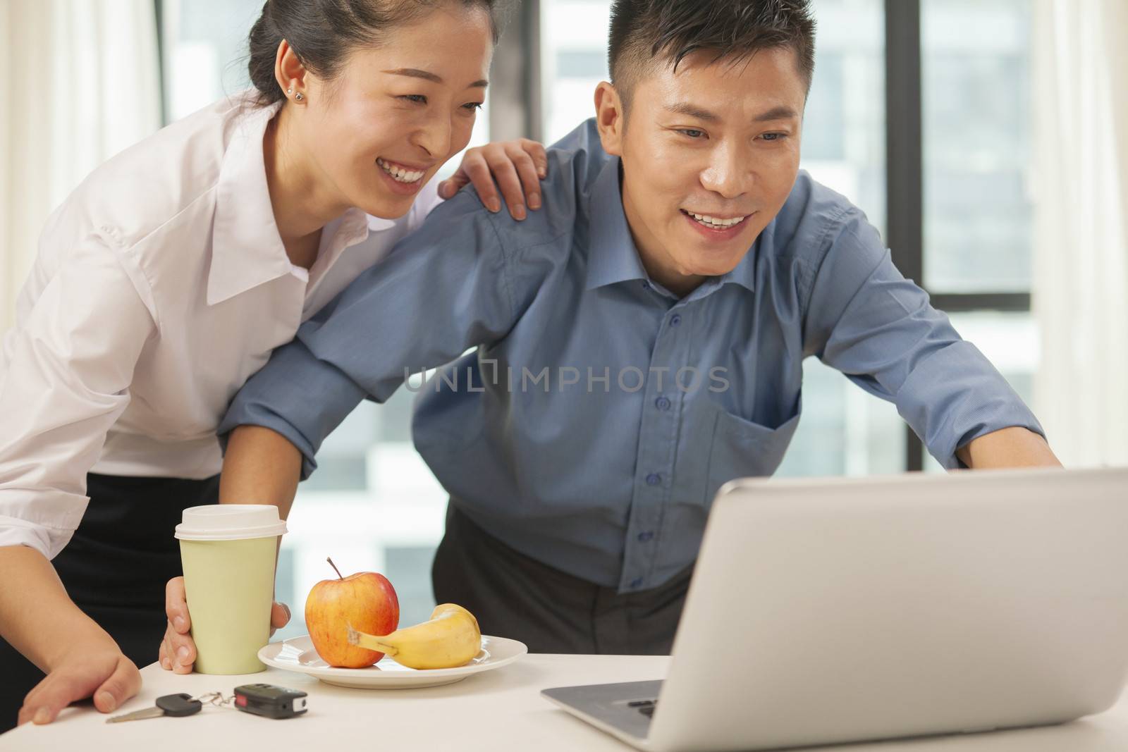 Business couple working together in hotel room 