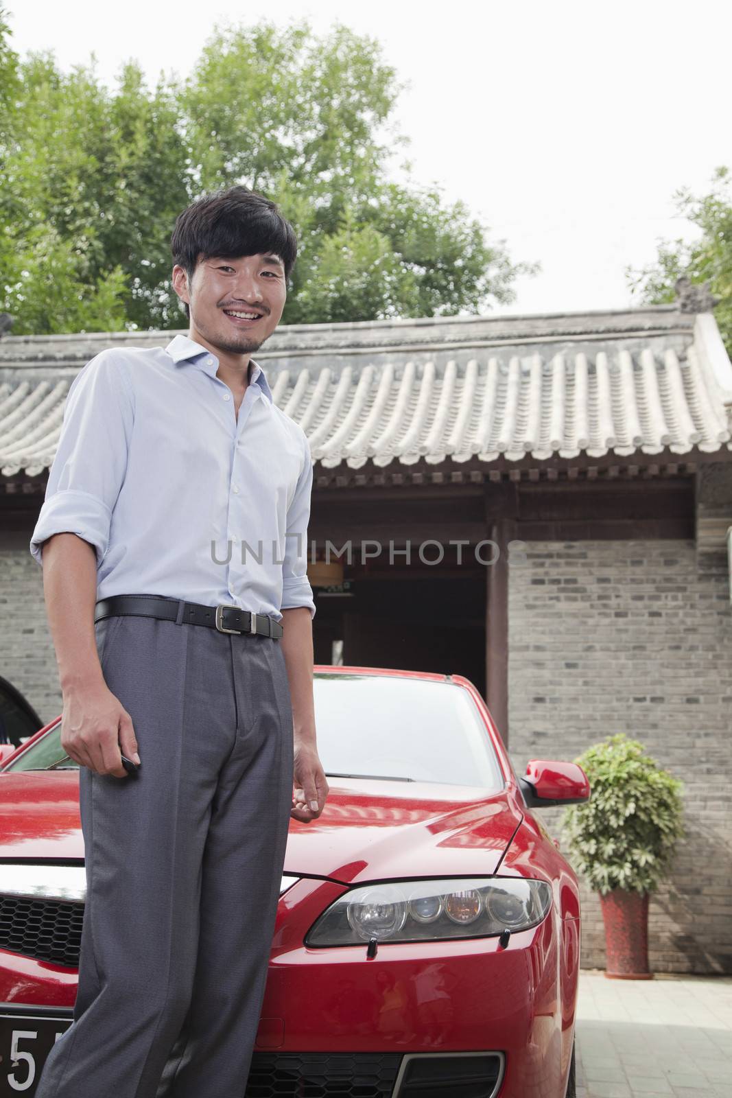 Young Businessman with His Car