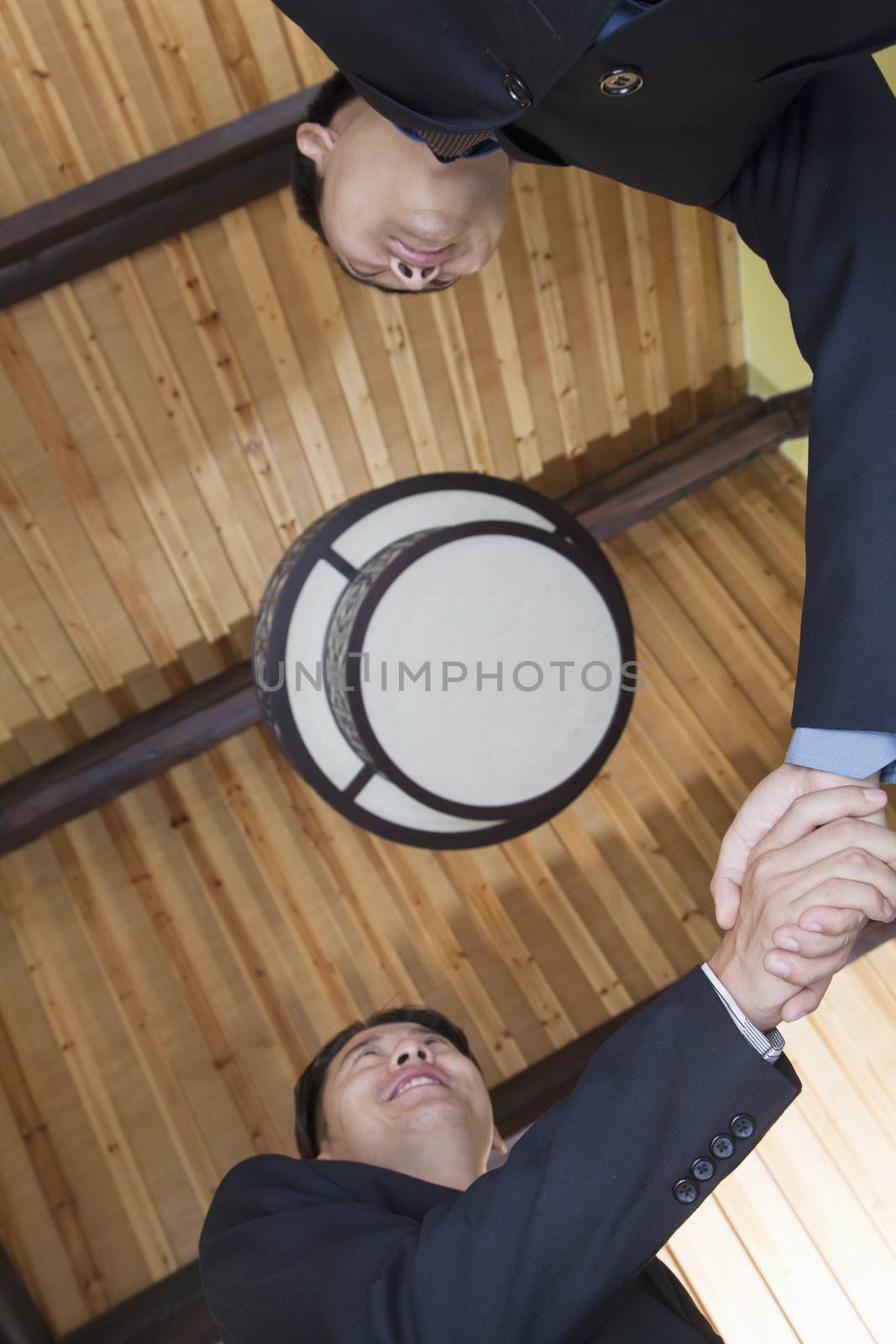 Low Angle View of Businessmen Shaking Hands