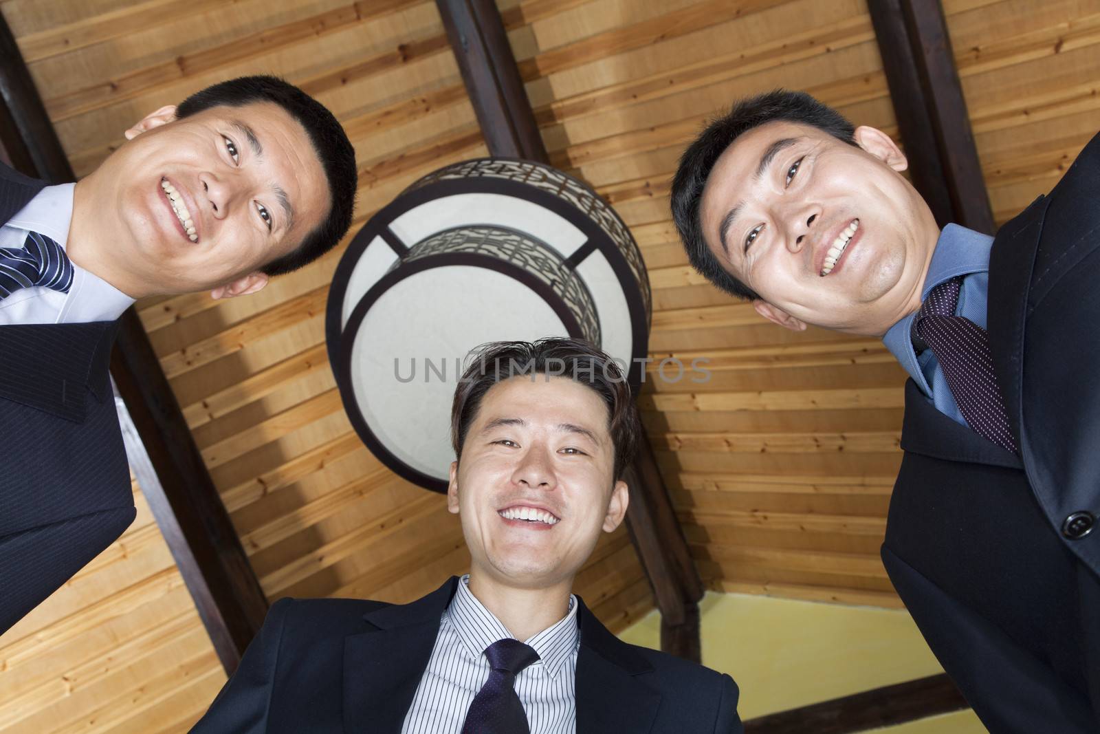 Low Angle Portrait of Three Businessmen