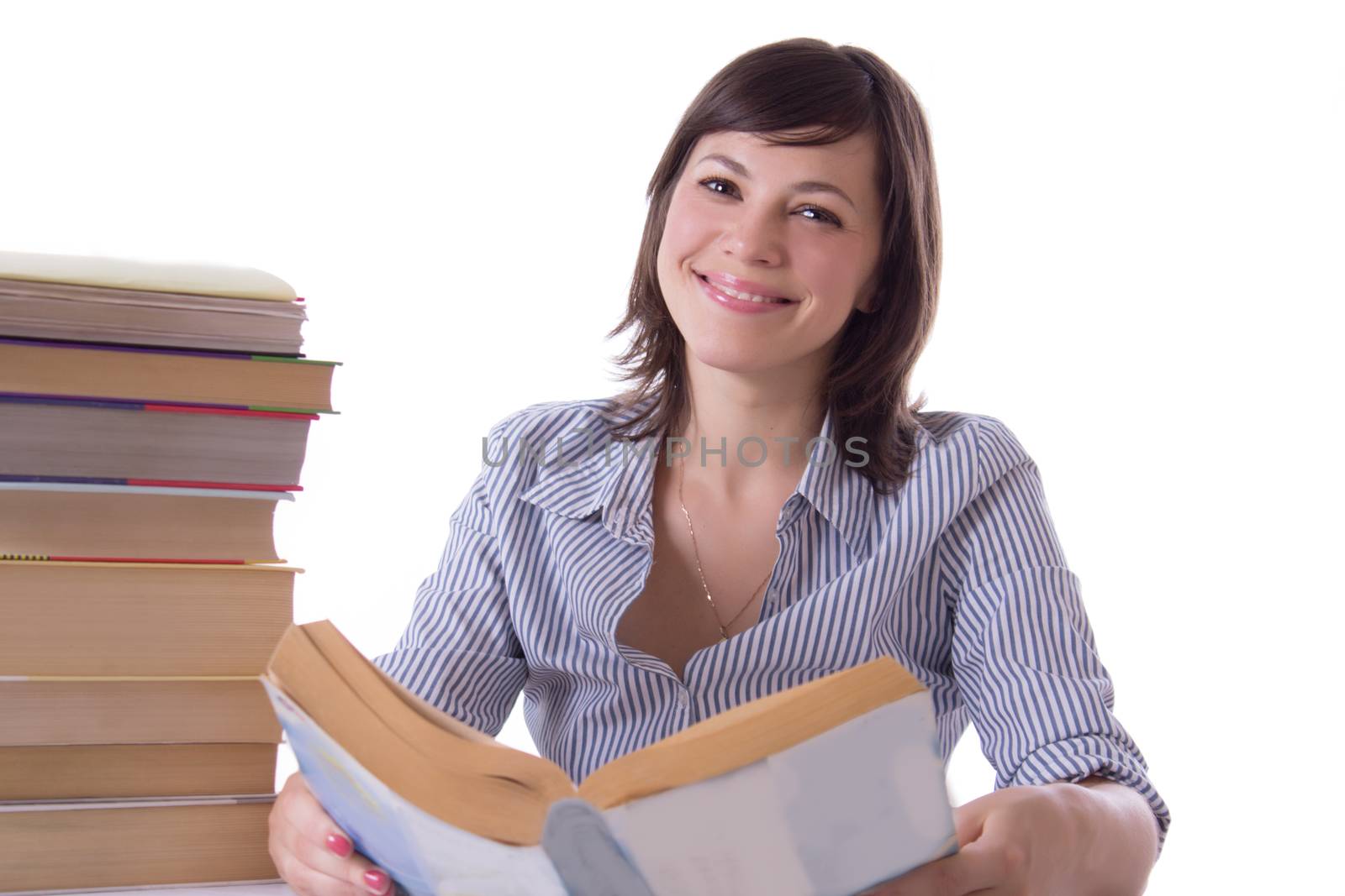 Smiling student girl with pile of books isolated over white