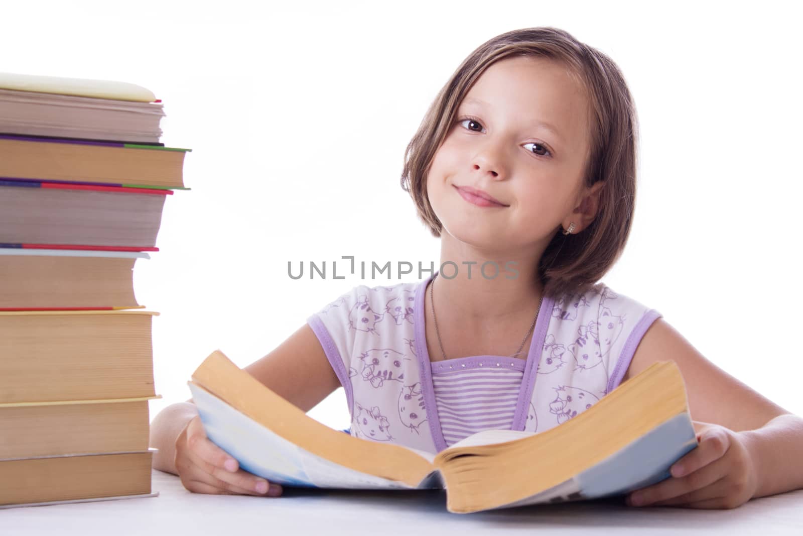 Pretty girl with pile of books isolated over white