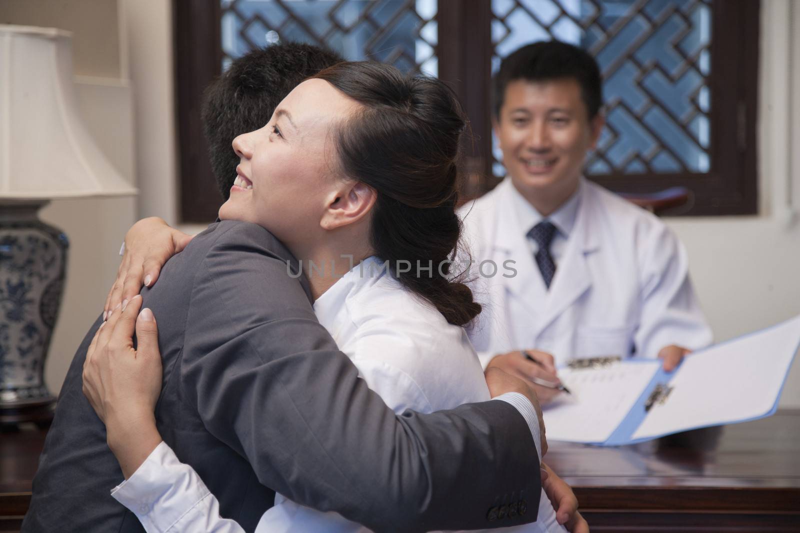 Patient and Spouse Hug at the Good News