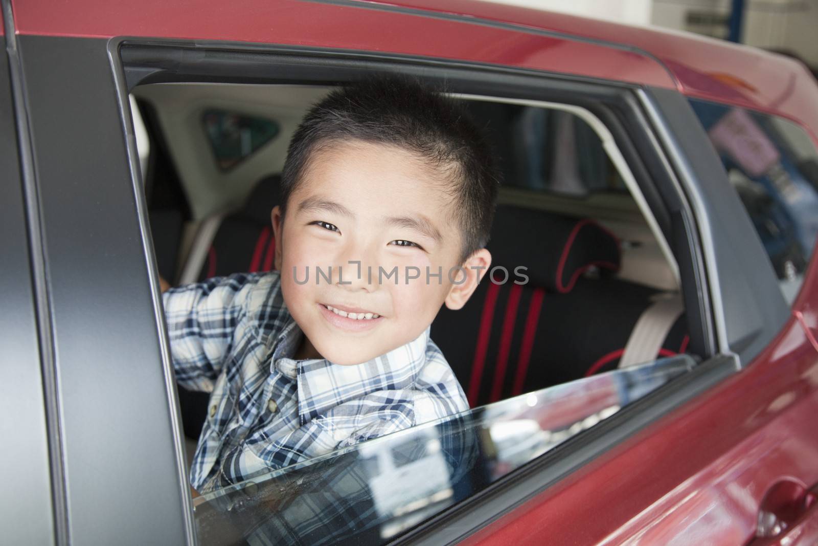 Young Boy Looking Out a Car Window