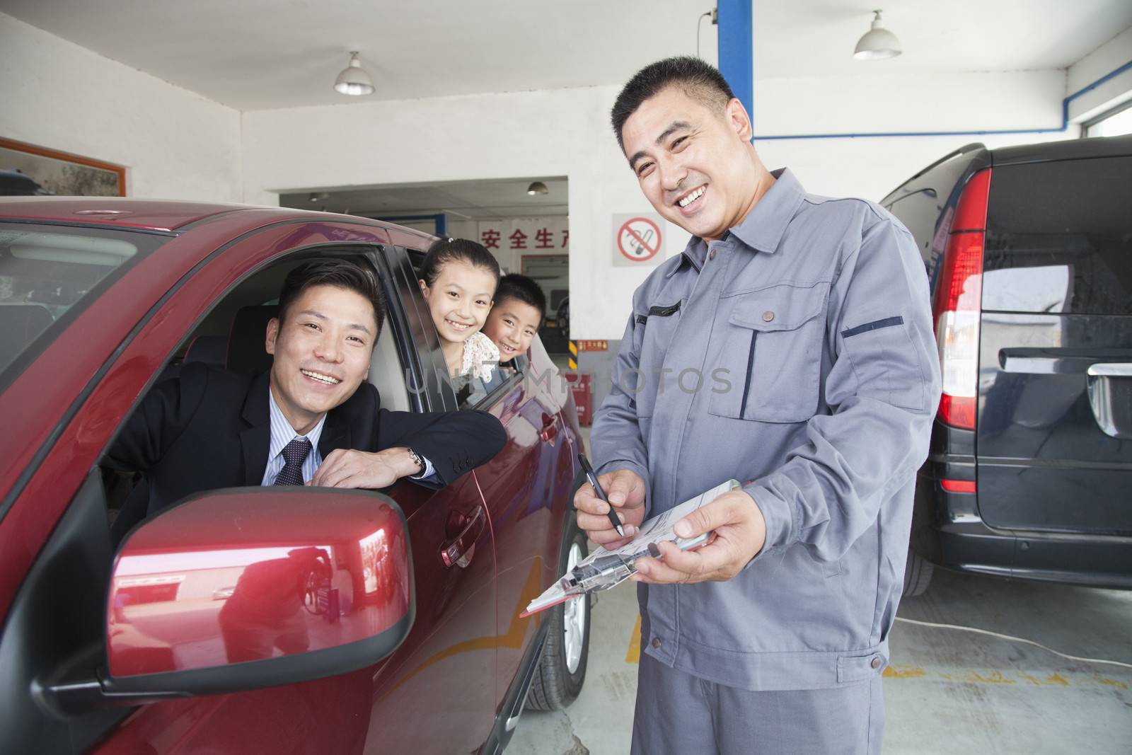 Mechanic Helping Family with Their Car by XiXinXing