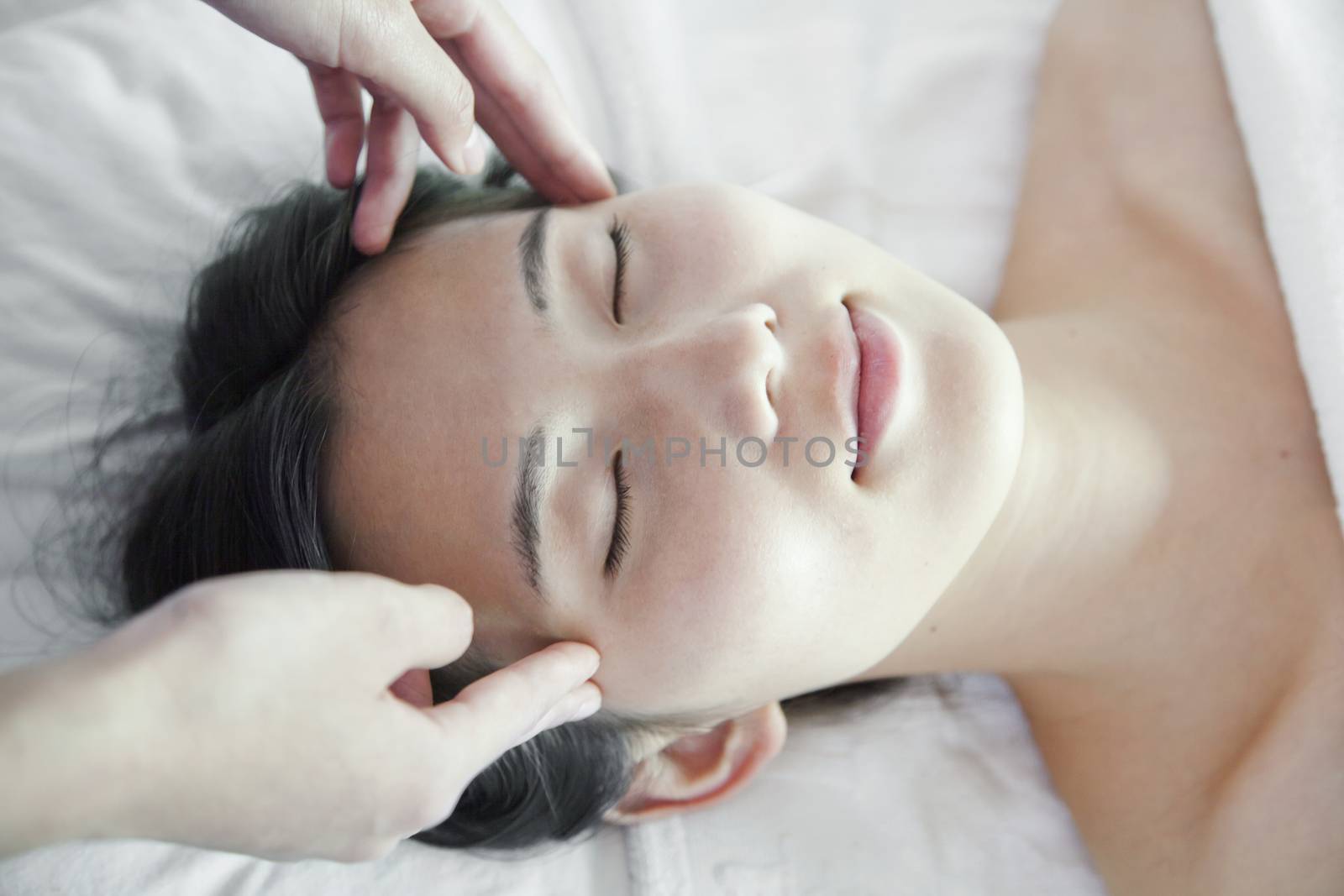 Woman Receiving Head Massage by XiXinXing