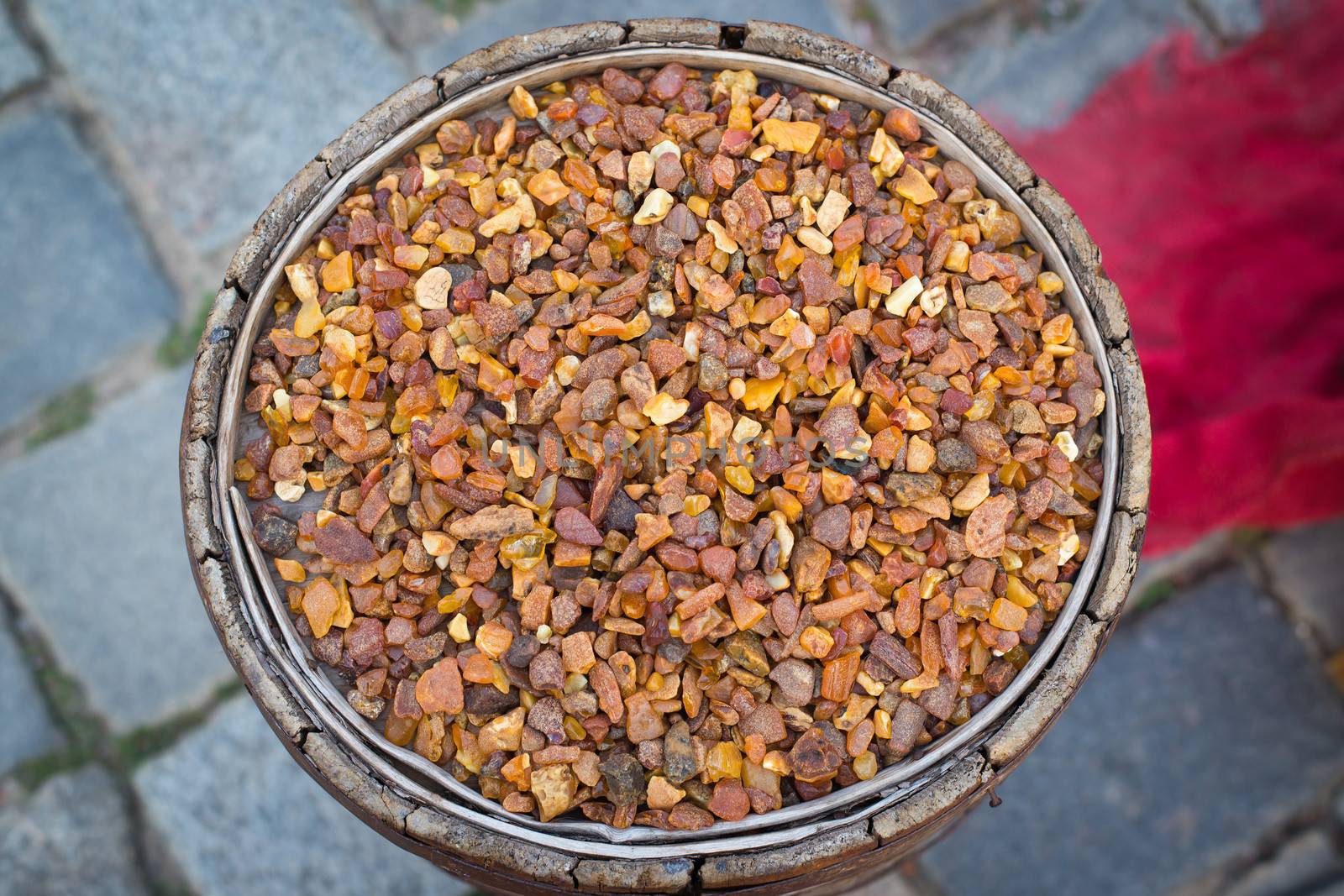 photo of old barrel filled with amber