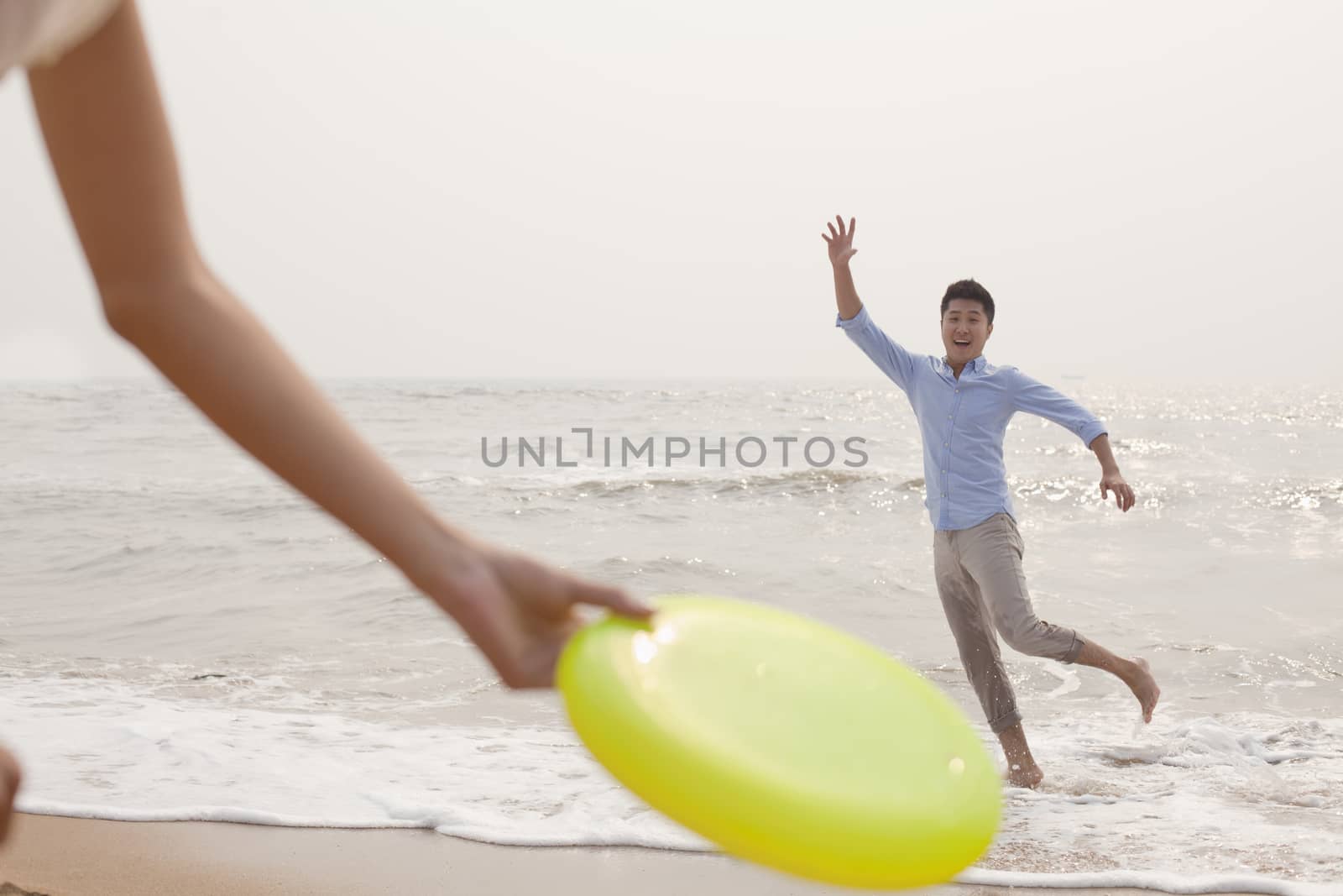 Young man preparing to catch Frisbee