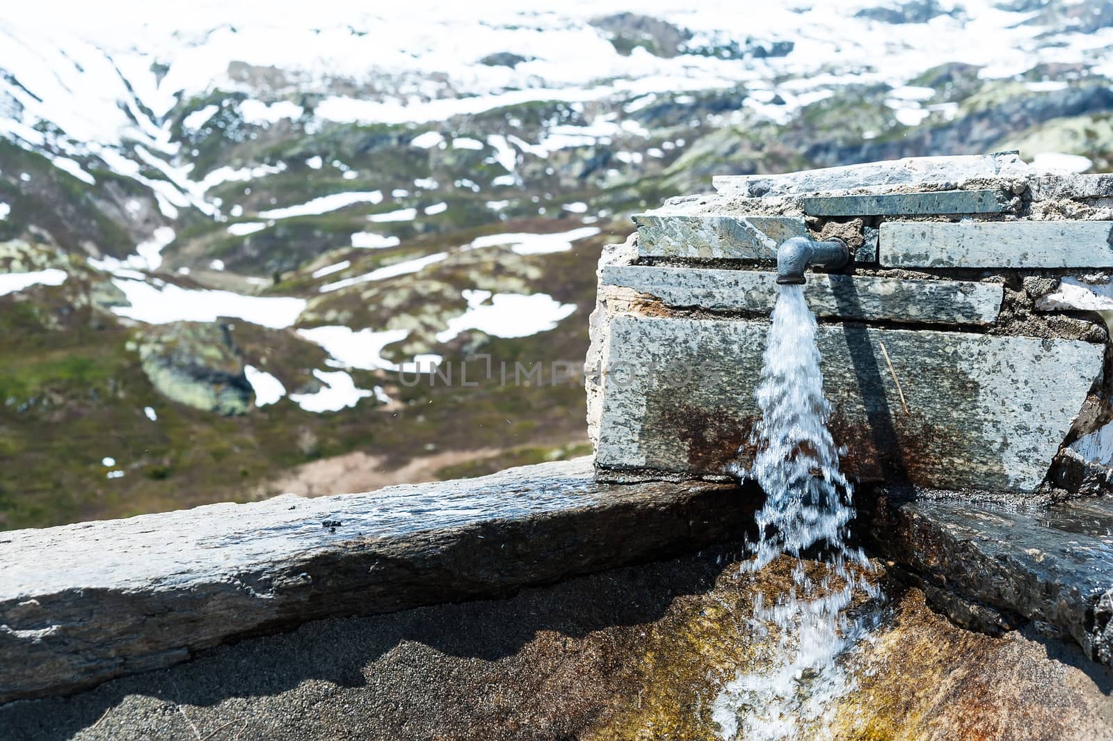 Potable water faucet on the Simplon pass, Italy