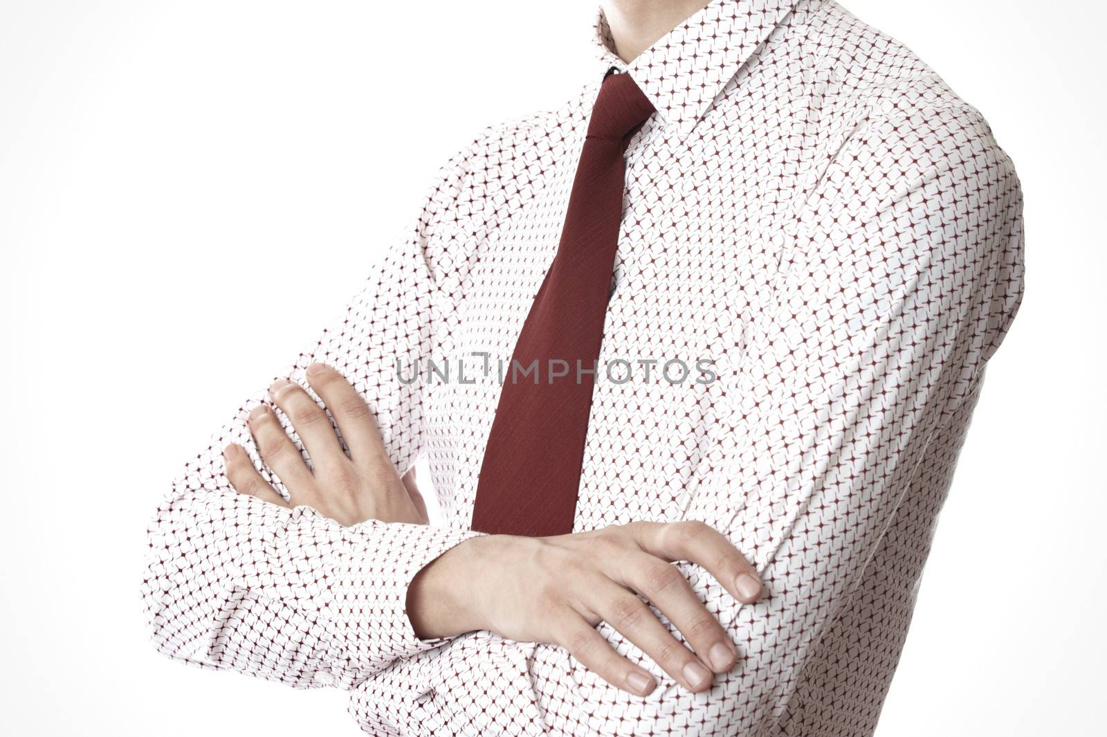 Torso of businessman with arms crossed on a white background