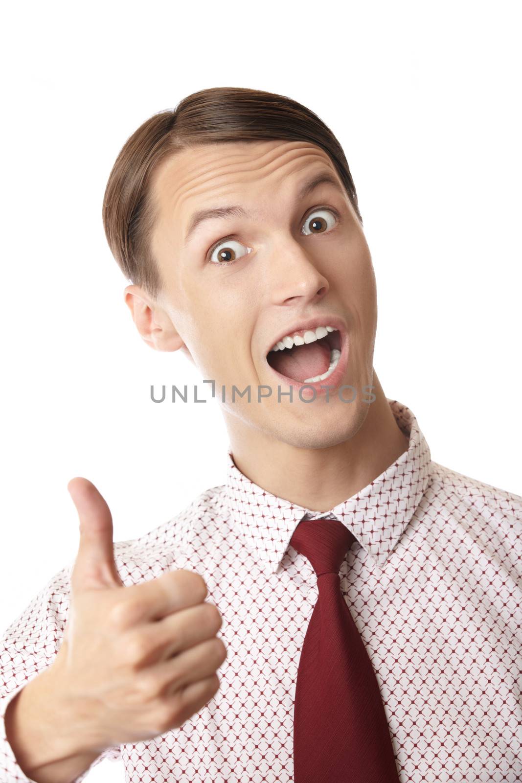 Successful businessman making thumbs up gesture on a white background