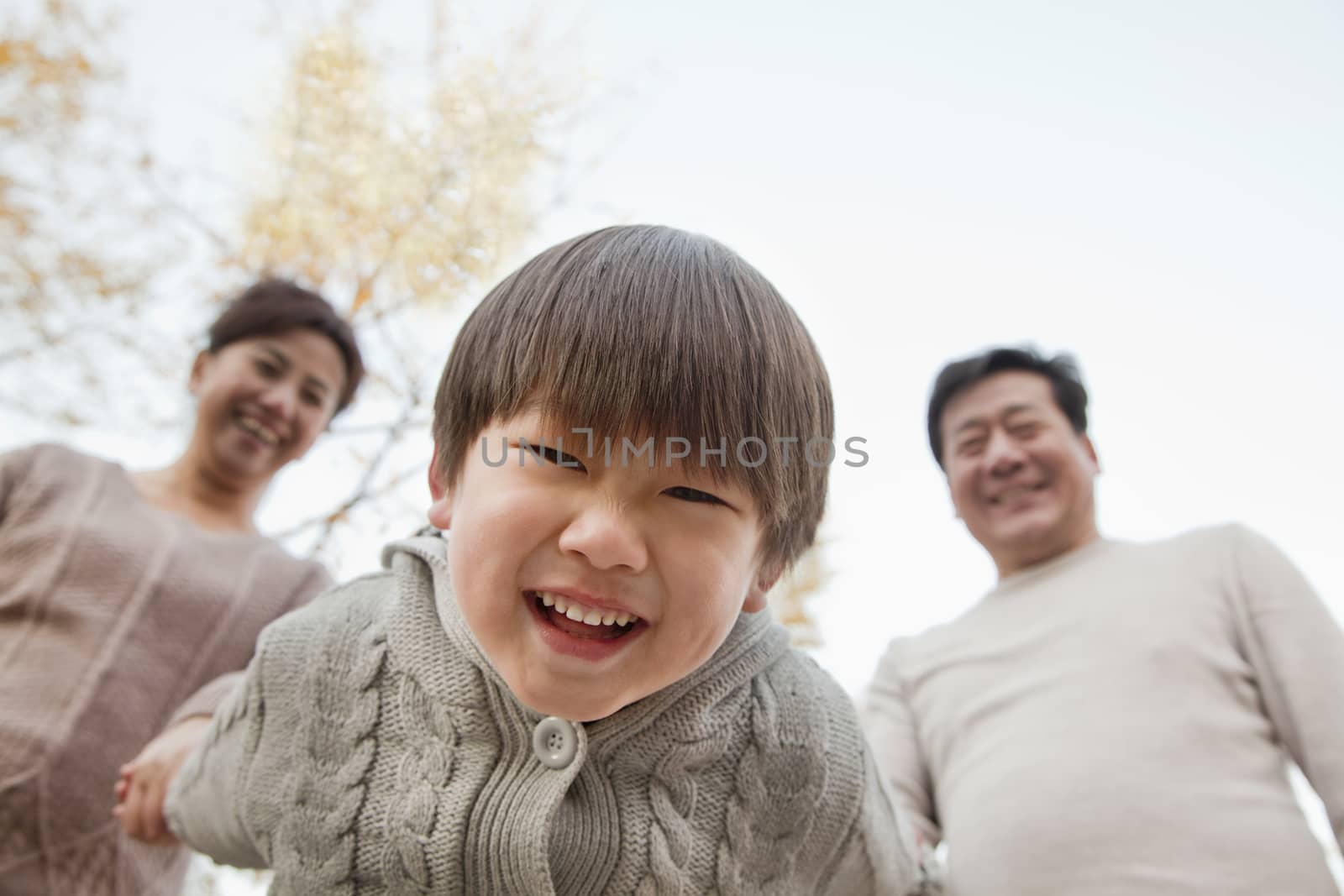 Close-Up Of Grandson Leaning into Camera by XiXinXing